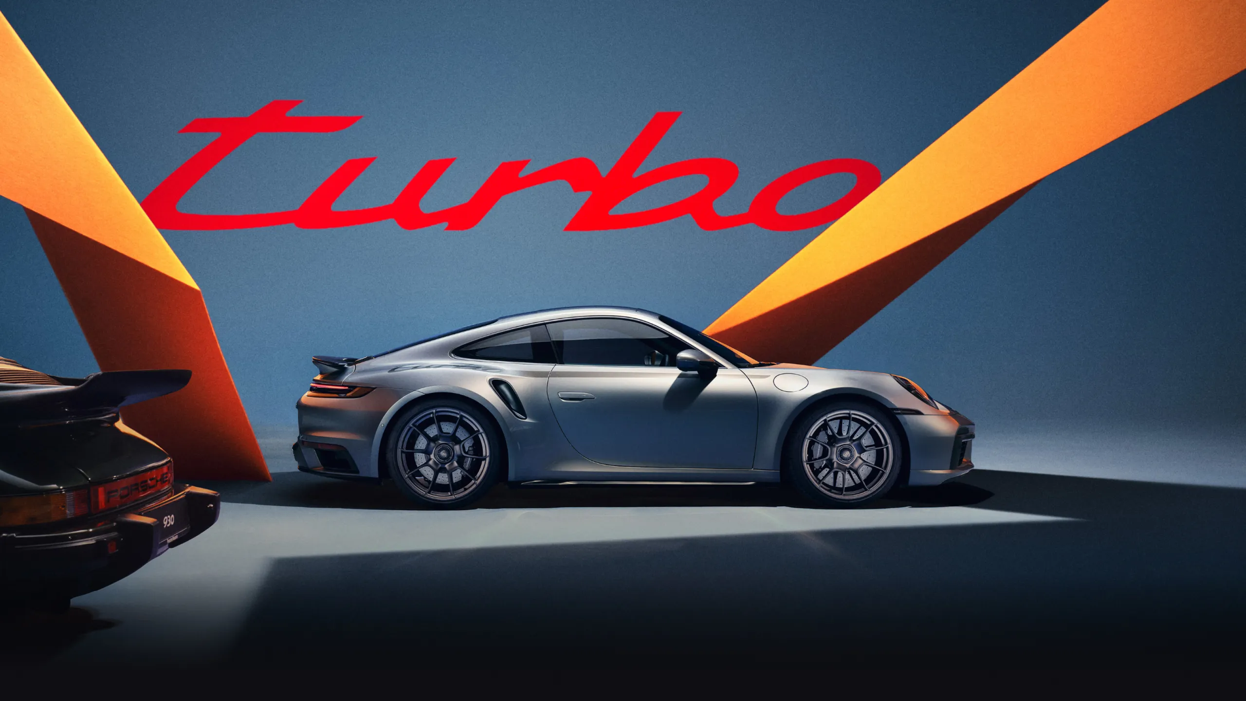 The Porsche 911 Turbo 50 Years in GT Silver Metallic is shown from the side and from the front.