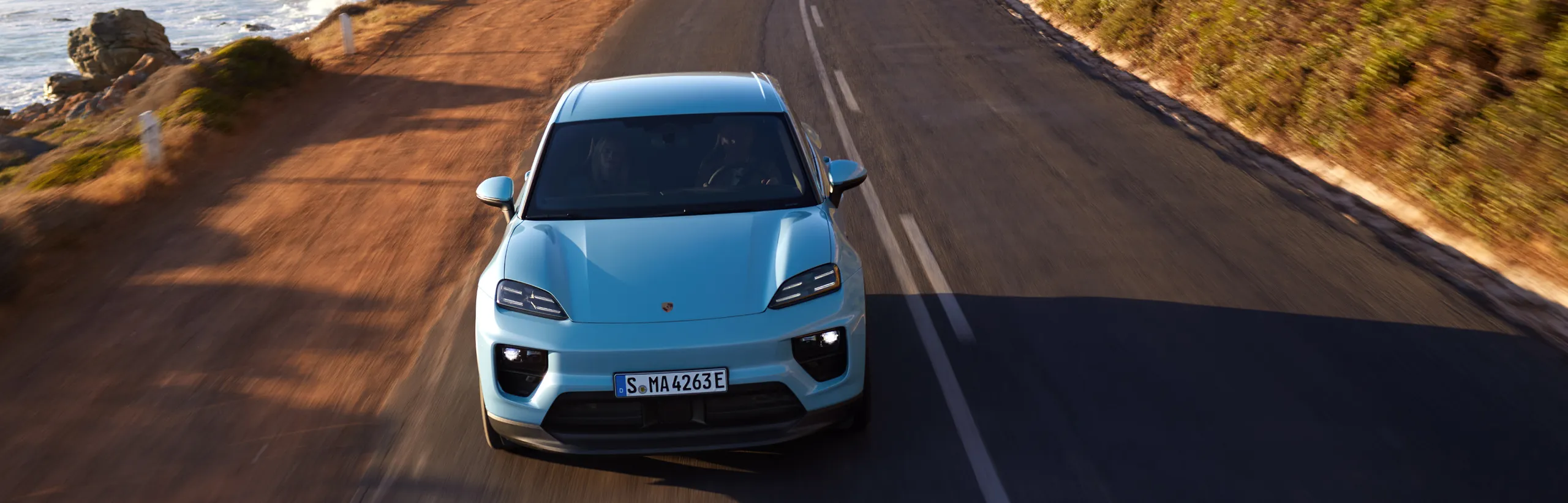 Porsche Macan in Frozen Blue Metallic in profile/side view.
