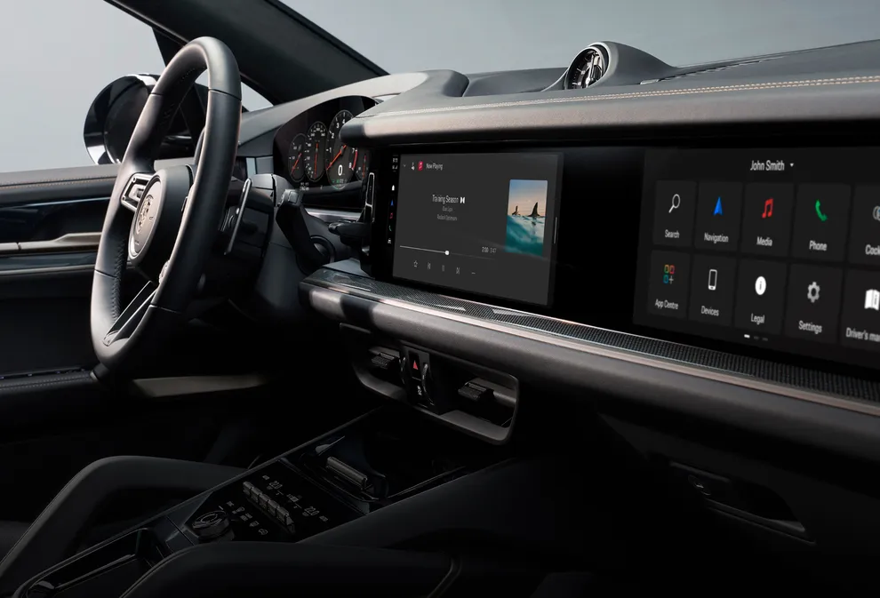 Porsche Cayenne Interieur: Detailansicht Mittelkonsolenbedienteil mit Steuerung des Infotainments im Cockpit.