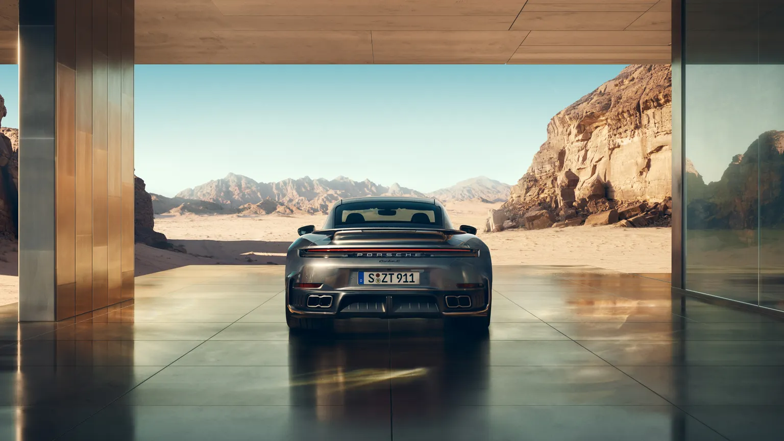 Rear end view of the Porsche 911 Turbo S in Vanadium Grey Metallic.