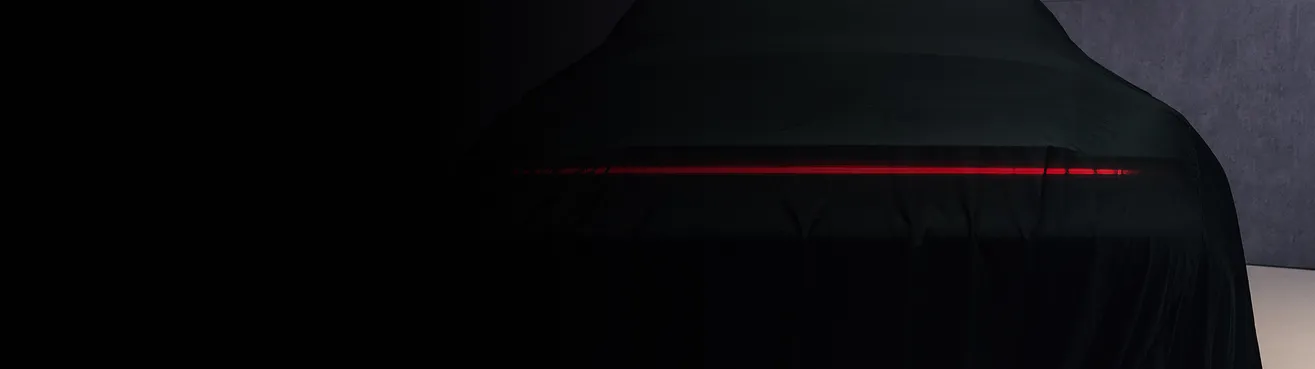 Teaser for a new vehicle from Porsche.