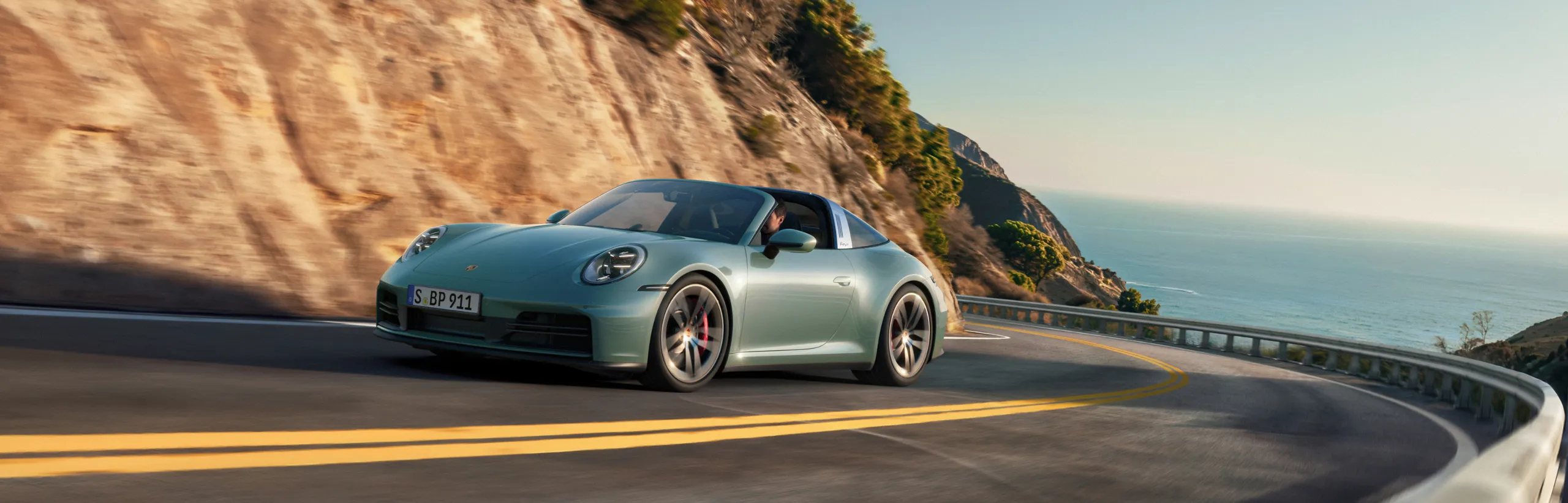 Porsche 911 Targa 4S in Shade Green Metallic. Side view.