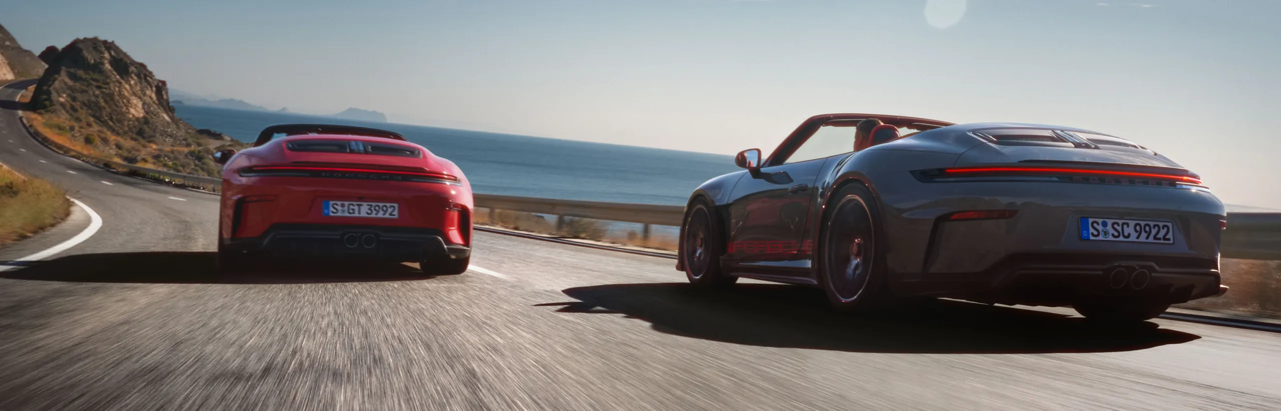 A Porsche 911 GT3 S/C in Slate Grey Neo with Street Style package and a Porsche 911 GT3 S/C in Guards Red side by side.