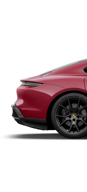 Zicht op de zijkant van de achterkant van de Porsche Taycan GTS in karmijnrood.