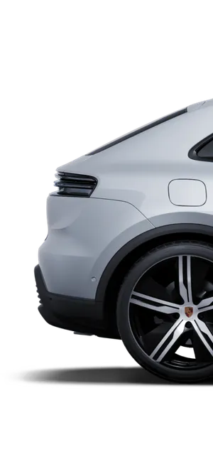 Un Porsche Macan Turbo Gris Glacé métallisé vu de profil/de côté.