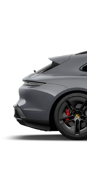 View of the side rear of the Porsche Taycan GTS Sport Turismo in Slate Grey Neo.