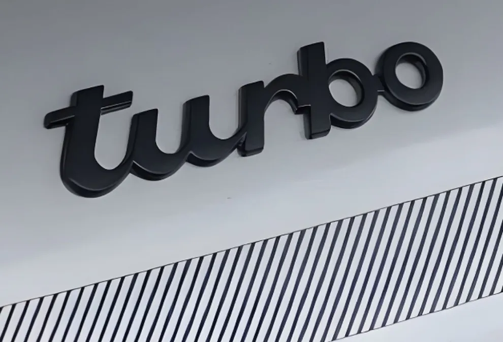 Detailed view of the "Turbo" lettering  on the rear of a Porsche 911 Turbo.