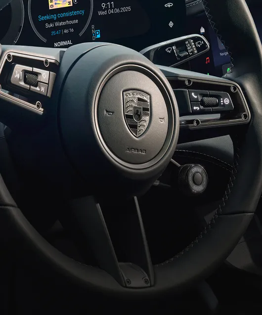 Porsche Taycan Turbo Cross Turismo interior. Detailed view of the steering wheel.