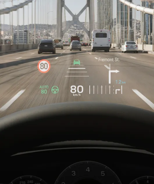 Porsche Cayenne interior: detailed view of the head-up display while driving.
