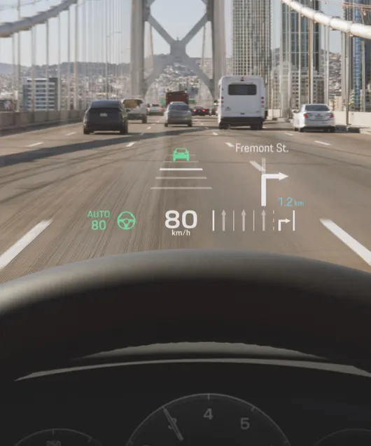 Porsche Cayenne interior: detailed view of the head-up display while driving.