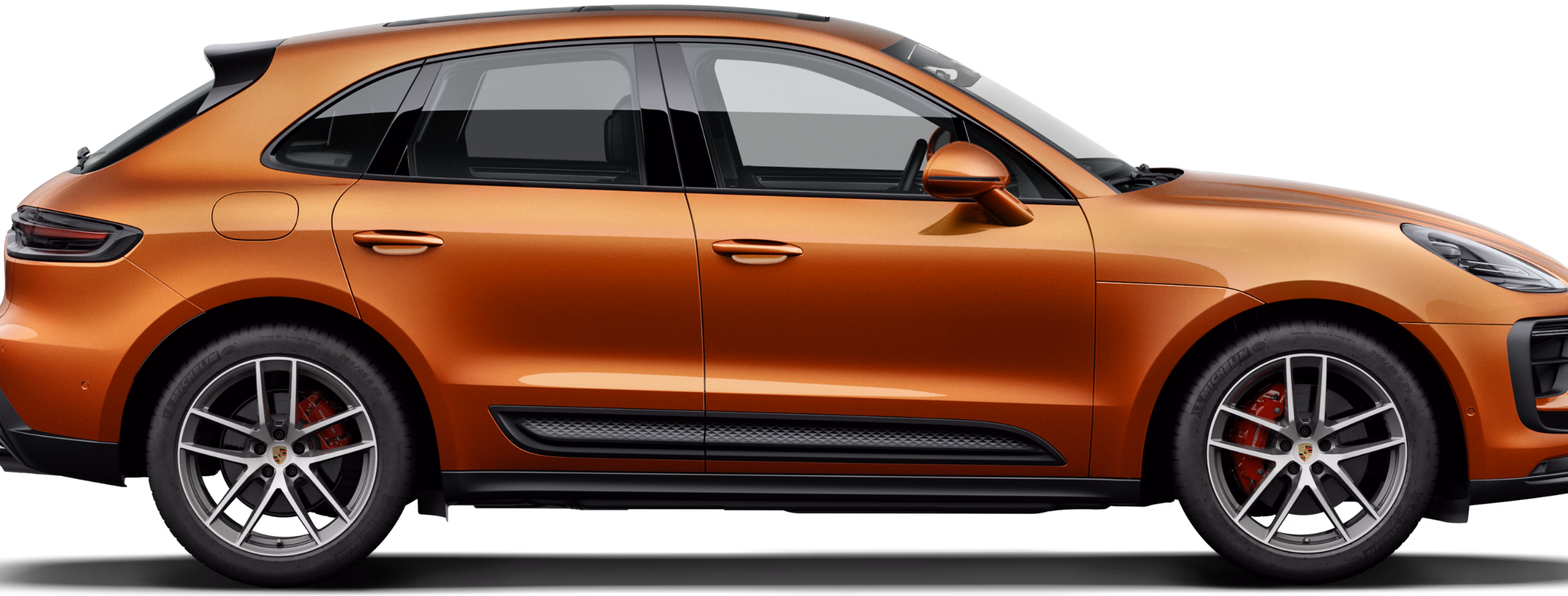 Porsche Macan S in Papaya Metallic in side view/profile.