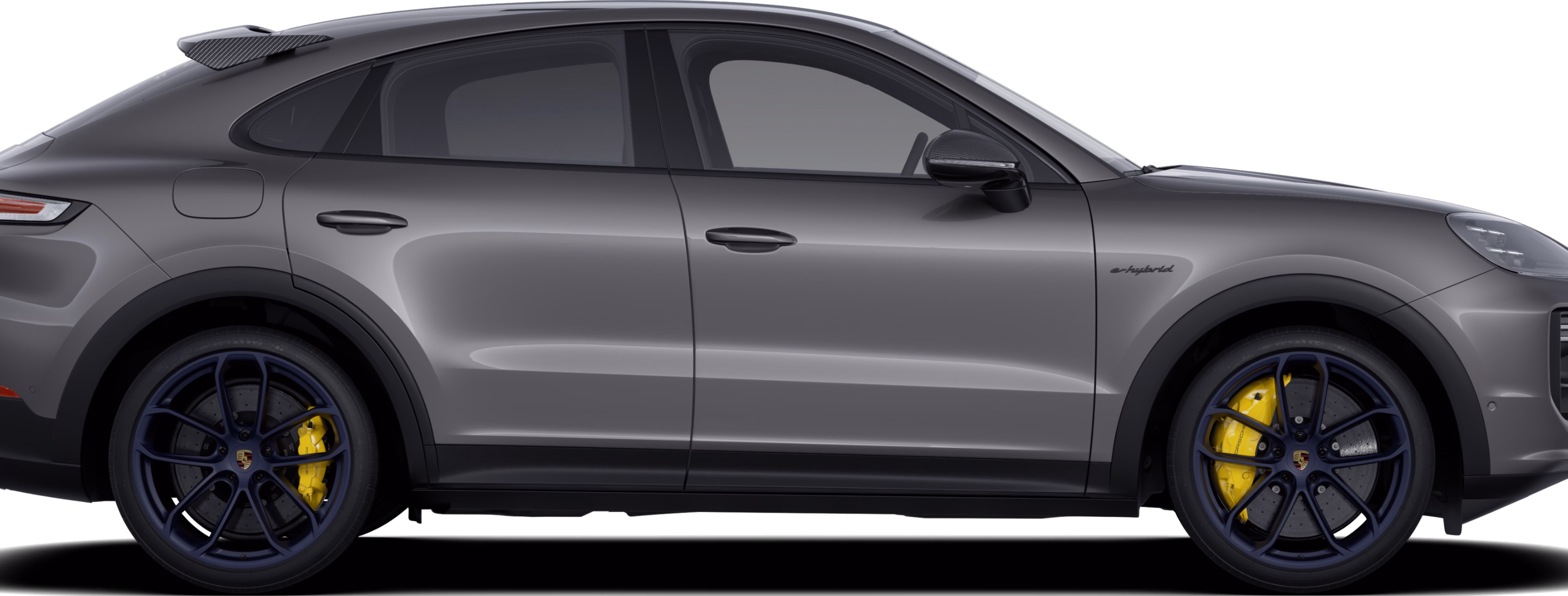 Vista lateral/perfil de un Porsche Cayenne Turbo E-Hybrid Coupé con paquete GT pintado en color Gris Cuarcita Metalizado.