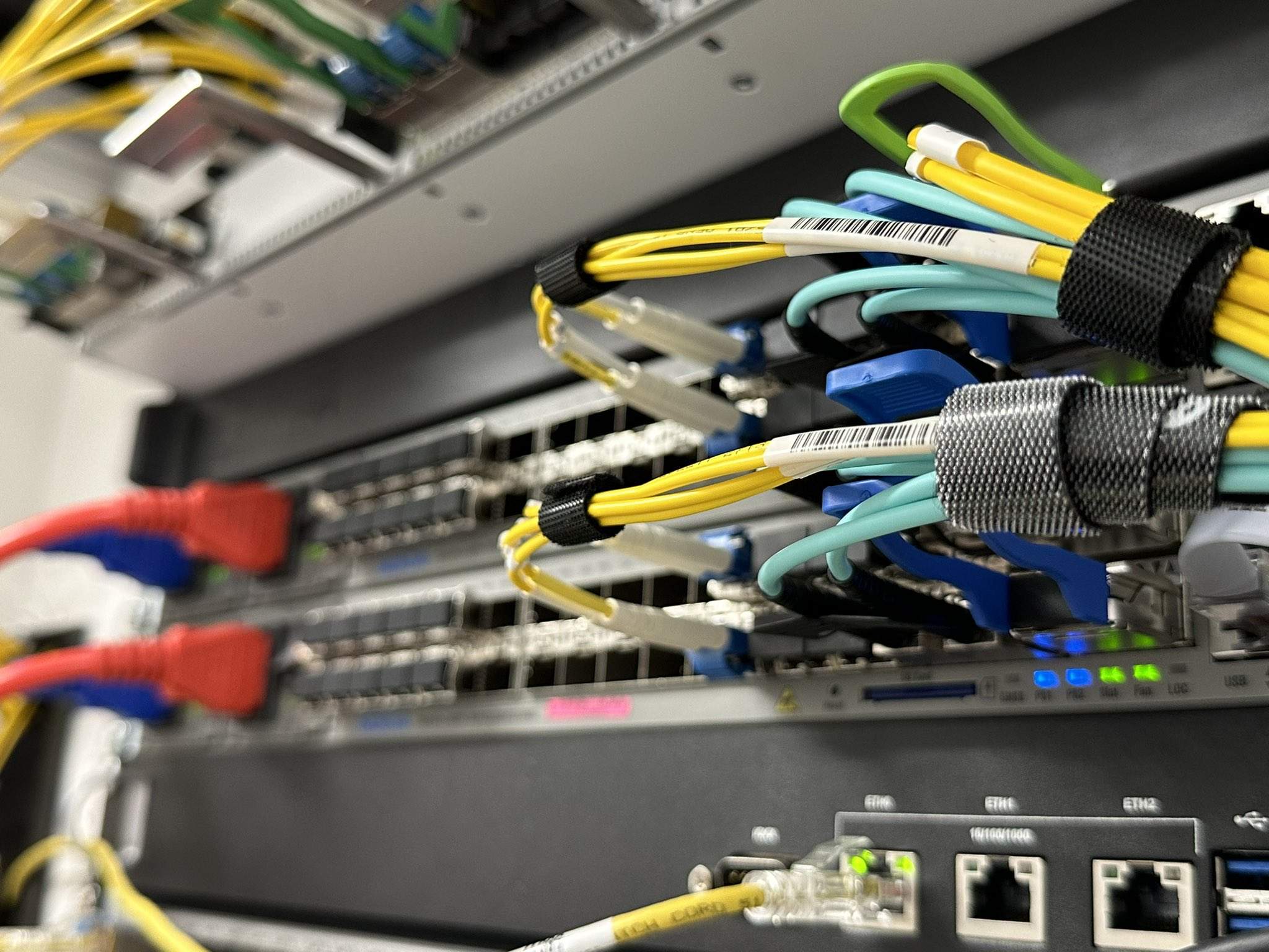 Image of a router with fibers connectd to it