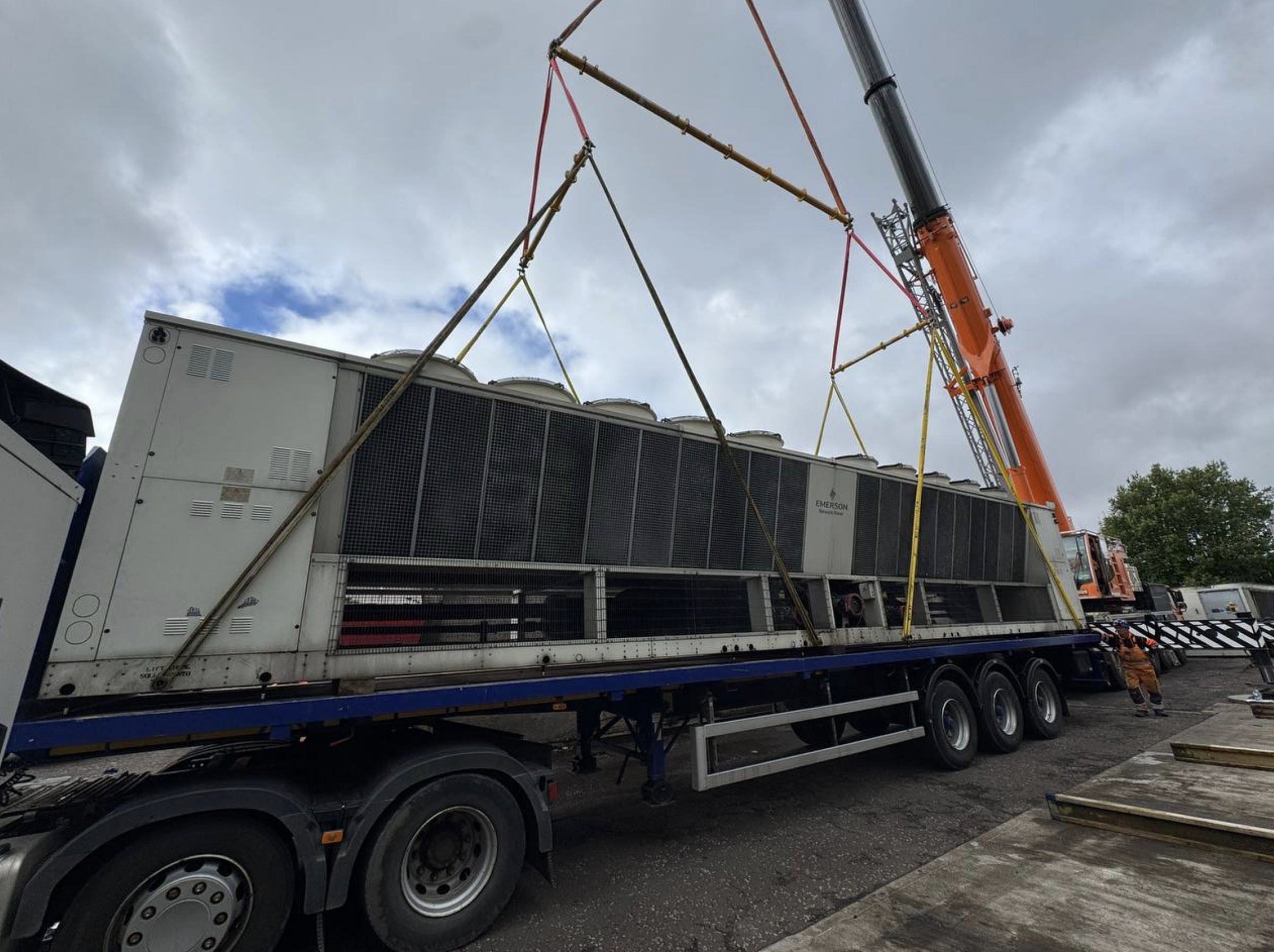 Hoist of a Emerson Datacenter cooling Unit from a truck