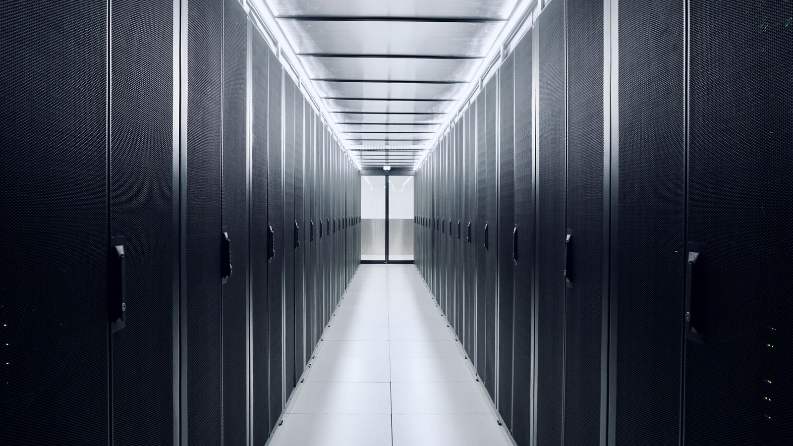 Cold aisle containment at DC2SCALE PAR3 datacenter, featuring APC racks and Inrow cooling systems for optimized airflow management