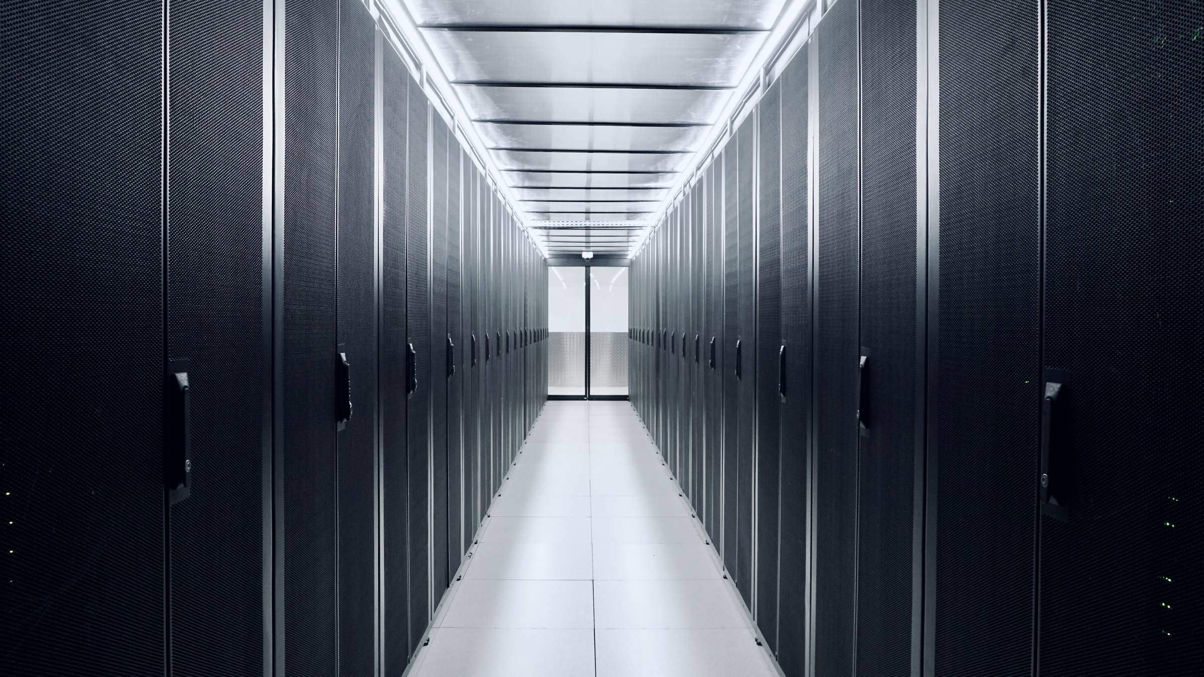 Cold aisle containment at DC2SCALE PAR3 datacenter, featuring APC racks and Inrow cooling systems for optimized airflow management