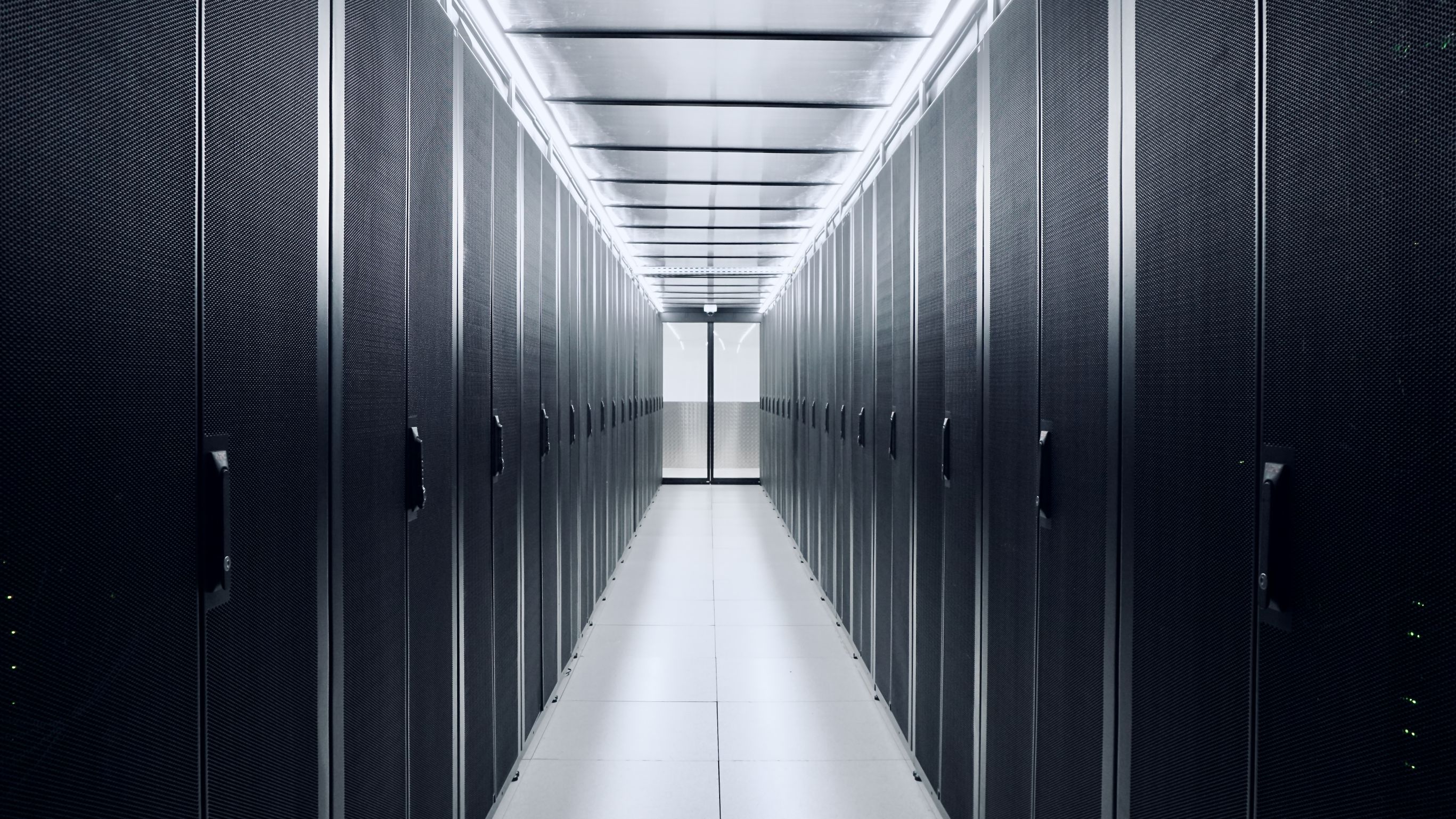 Cold aisle containment at DC2SCALE PAR3 datacenter, featuring APC racks and Inrow cooling systems for optimized airflow management