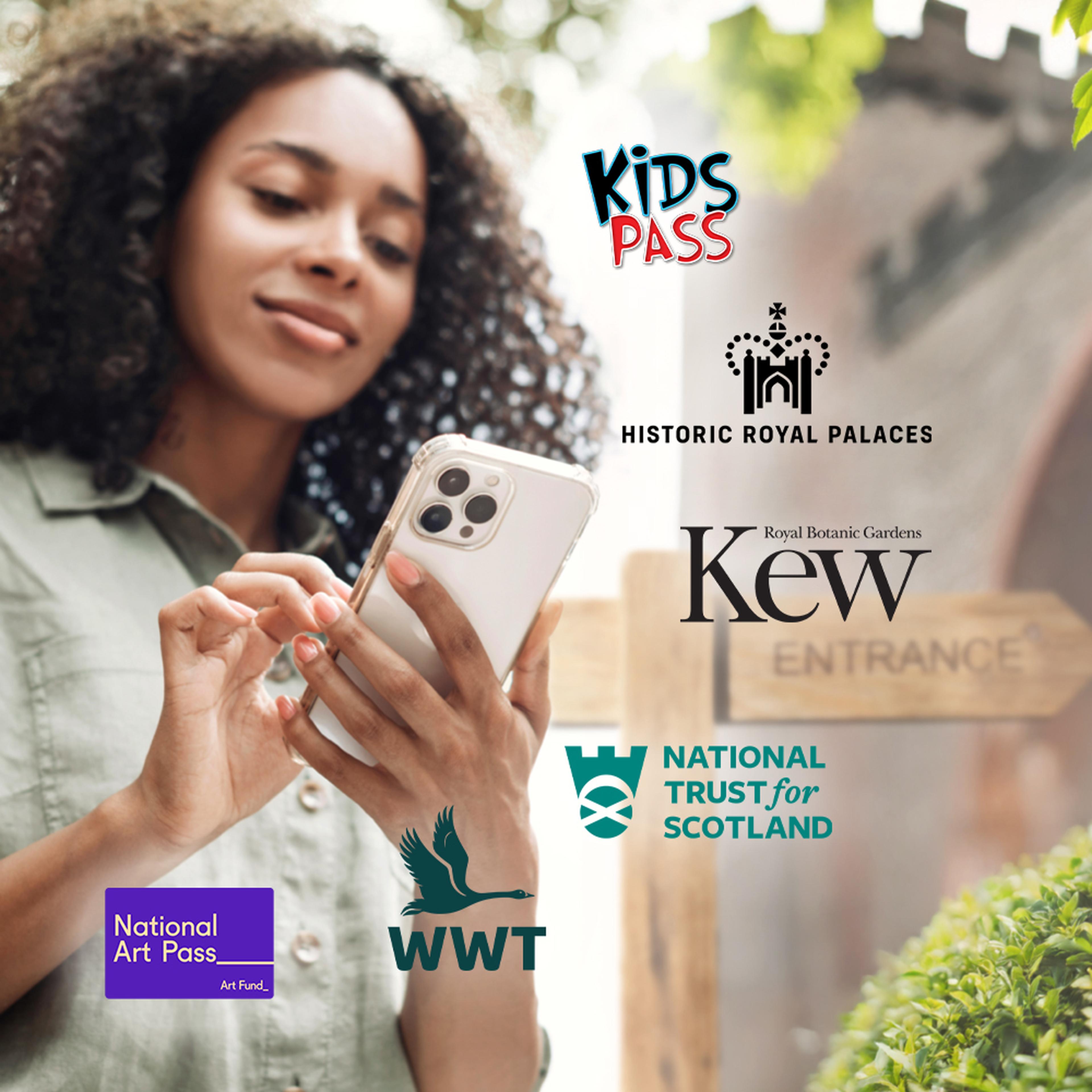 Woman using smartphone outdoors with logos of Kids Pass, Historic Royal Palaces, Kew Gardens, National Trust for Scotland, WWT, and National Art Pass.