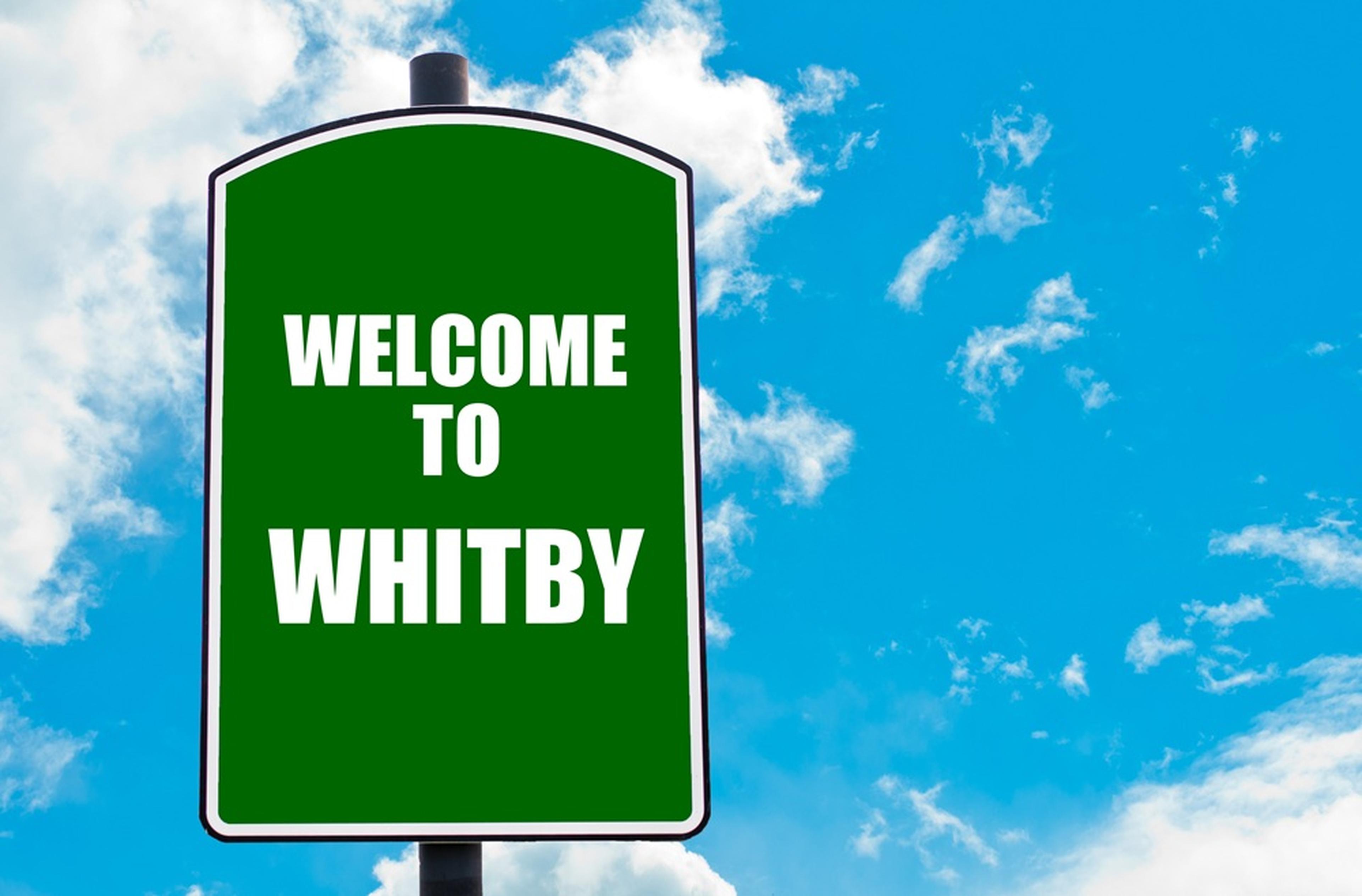 Green sign reading "Welcome to Whitby"