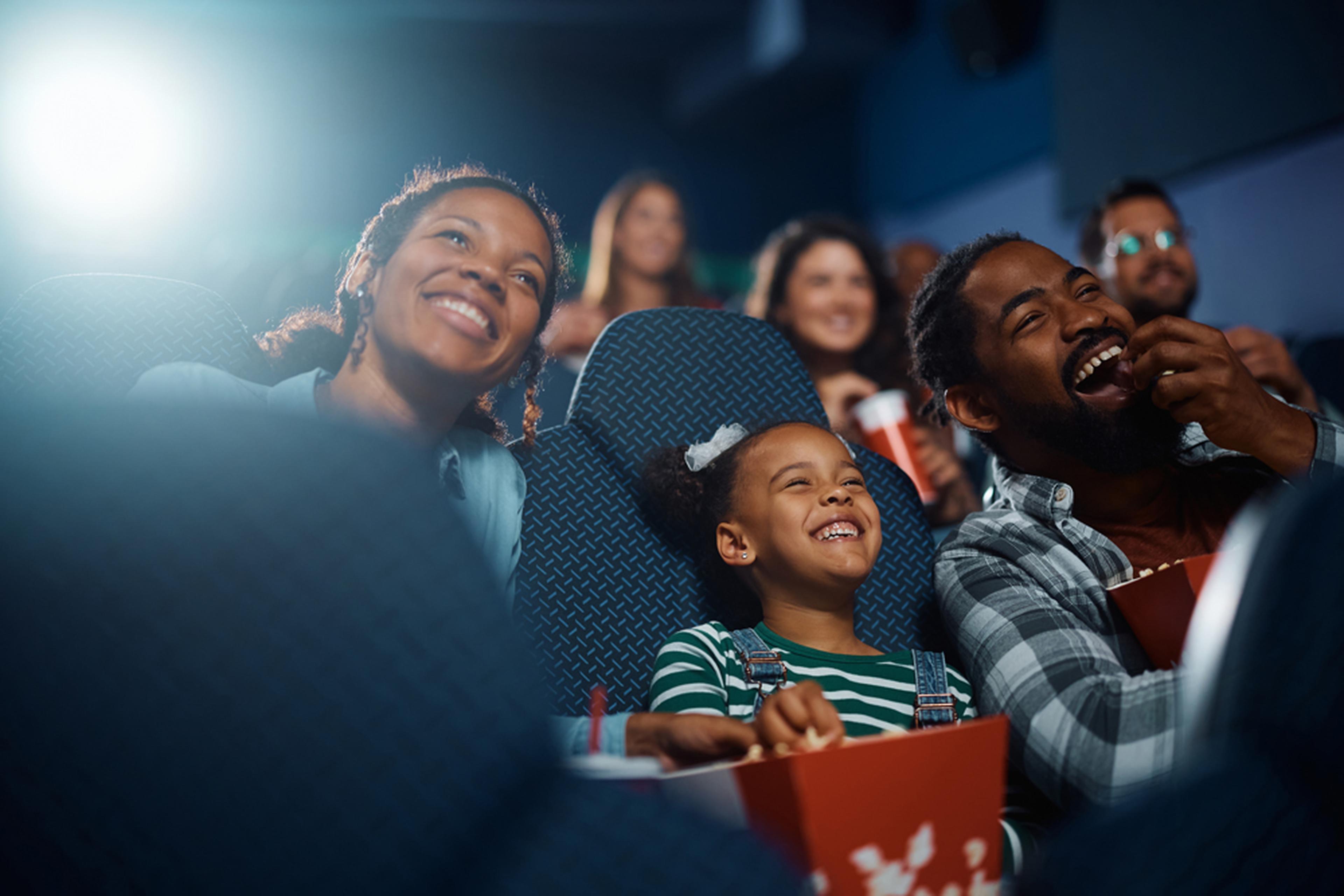 Family enjoying the cinema