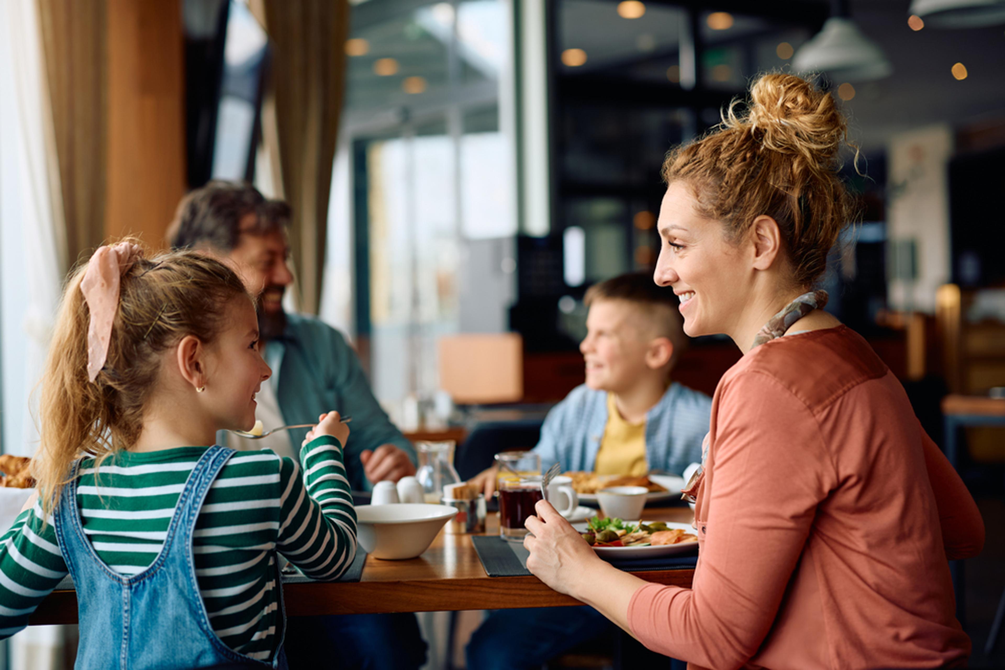Family dining out in cafe