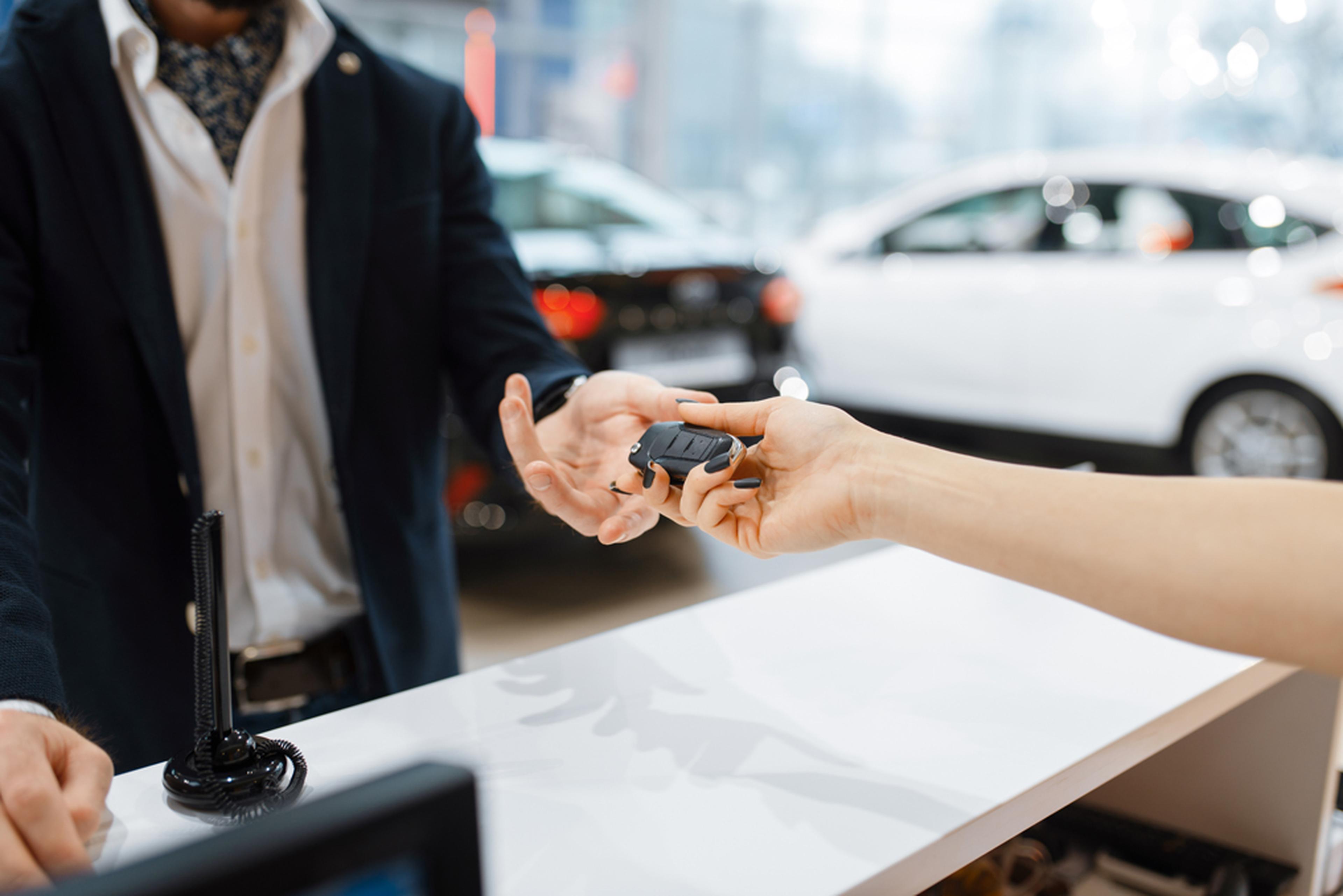 Man receiving keys for rented car