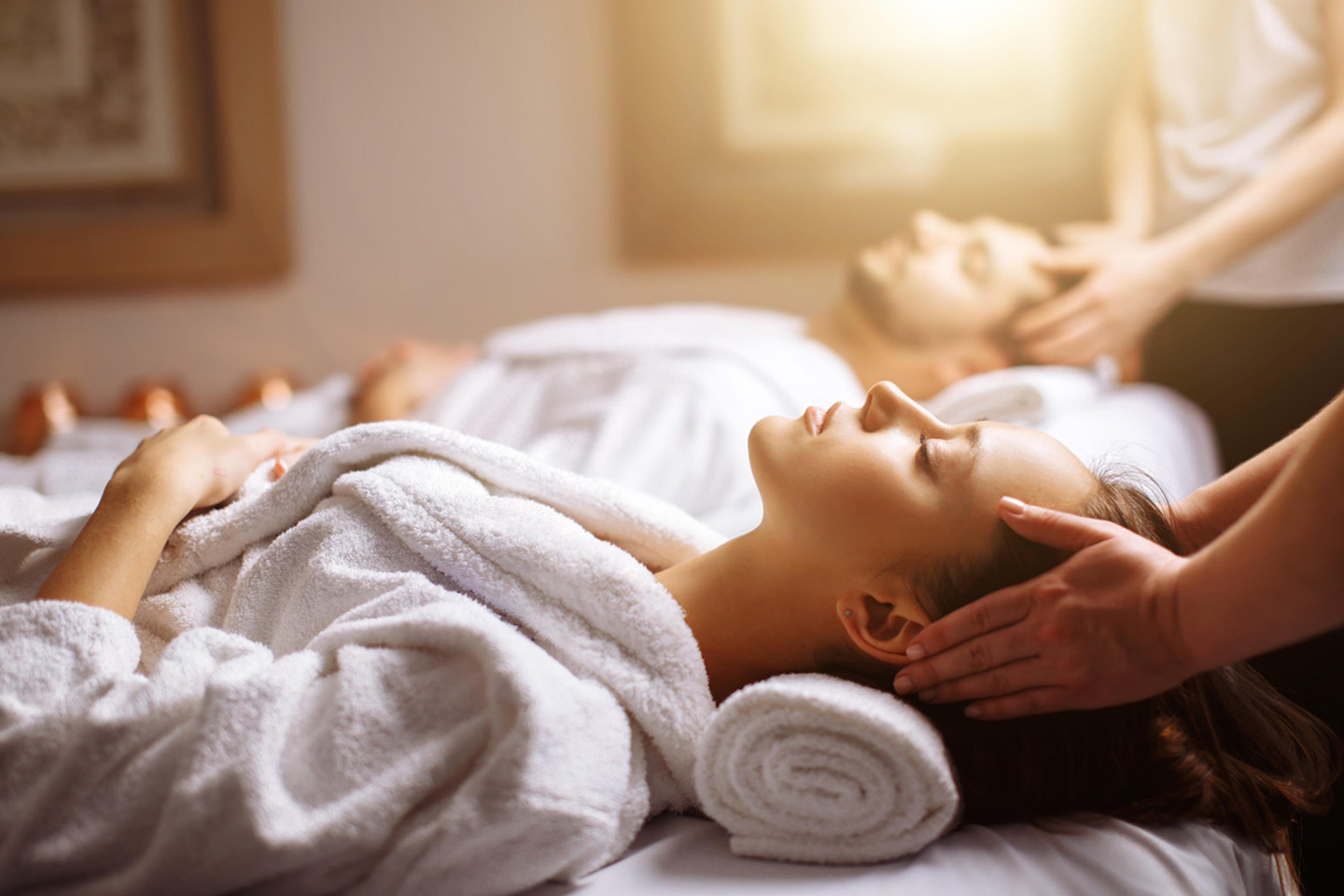 Two people enjoying a spa massage.