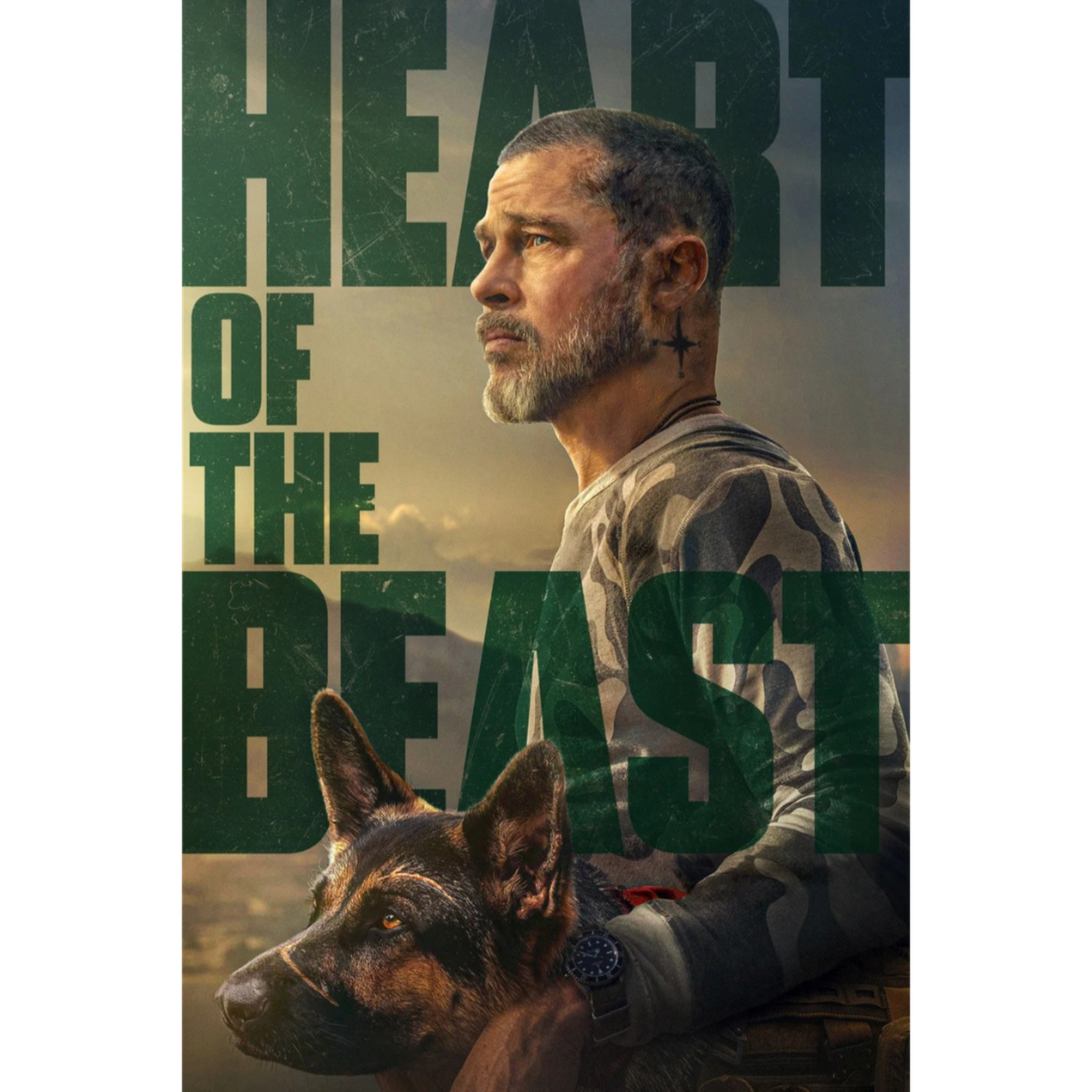 Movie poster for “Heart of the Beast” featuring a bearded man in profile wearing camouflage, standing beside a German Shepherd against a rugged, warm-toned background. Large green text reads “HEART OF THE BEAST.”