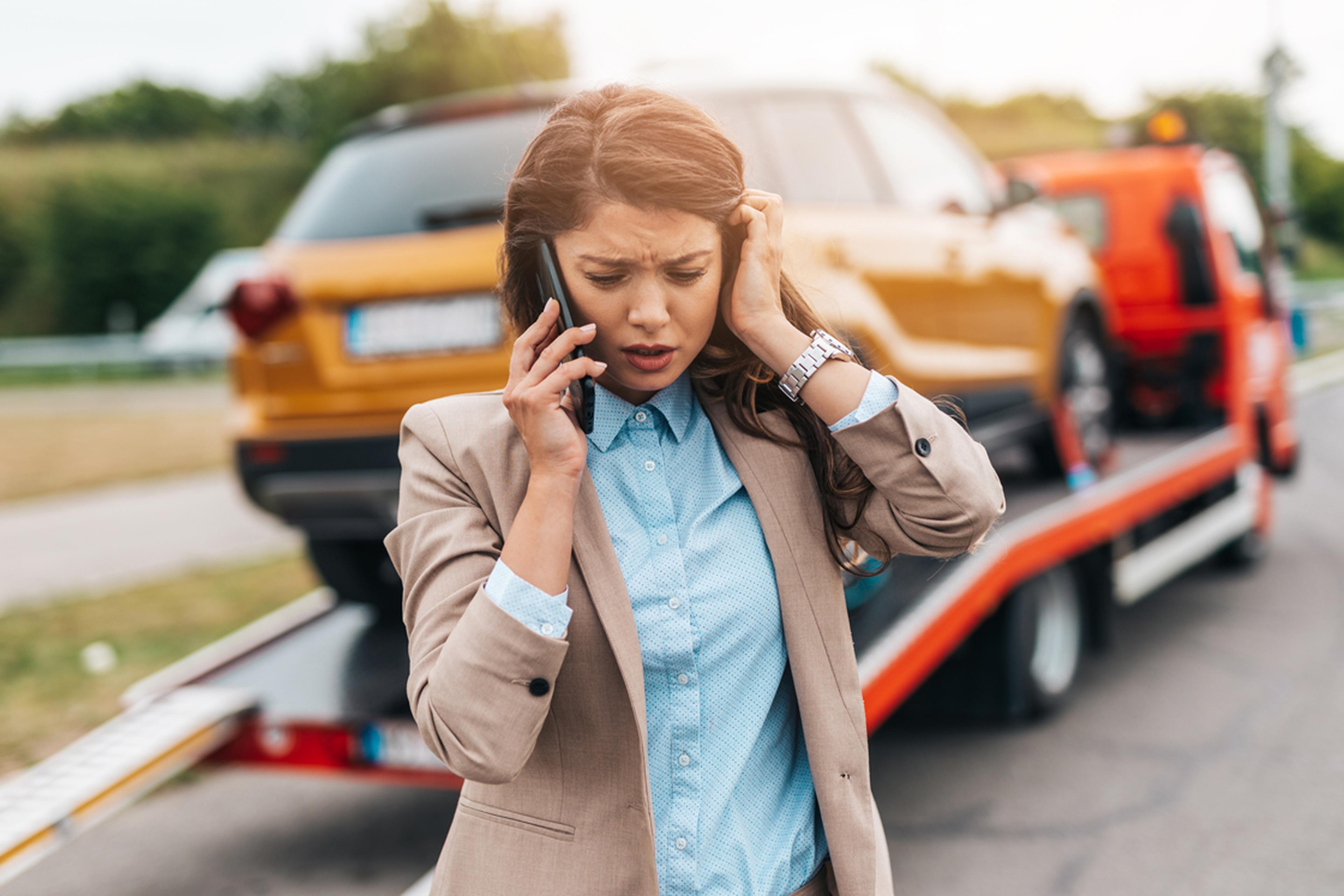 Lady calling up vehicle rescue