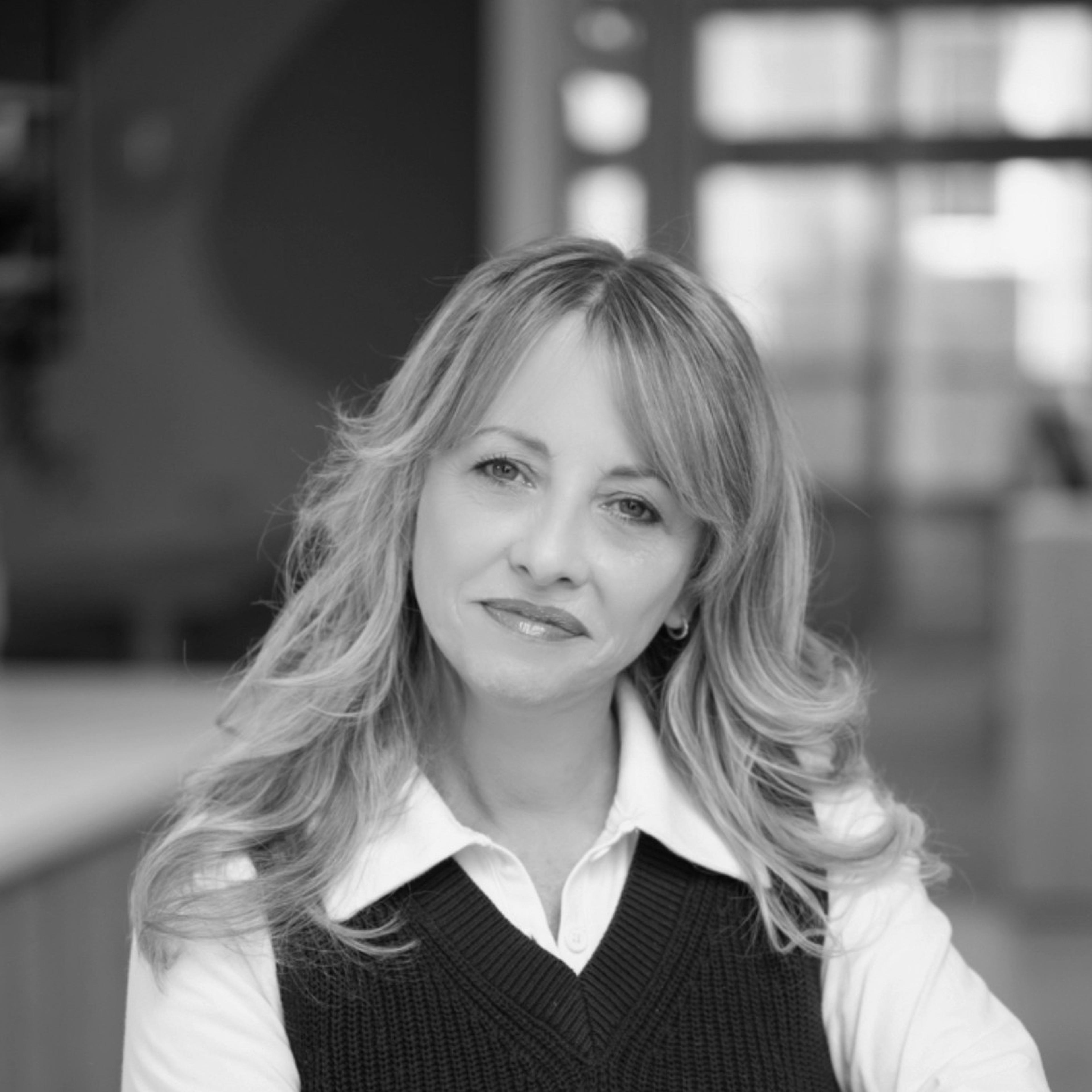 a headshot of Clair McMahon: Chief Community & Operations Officer