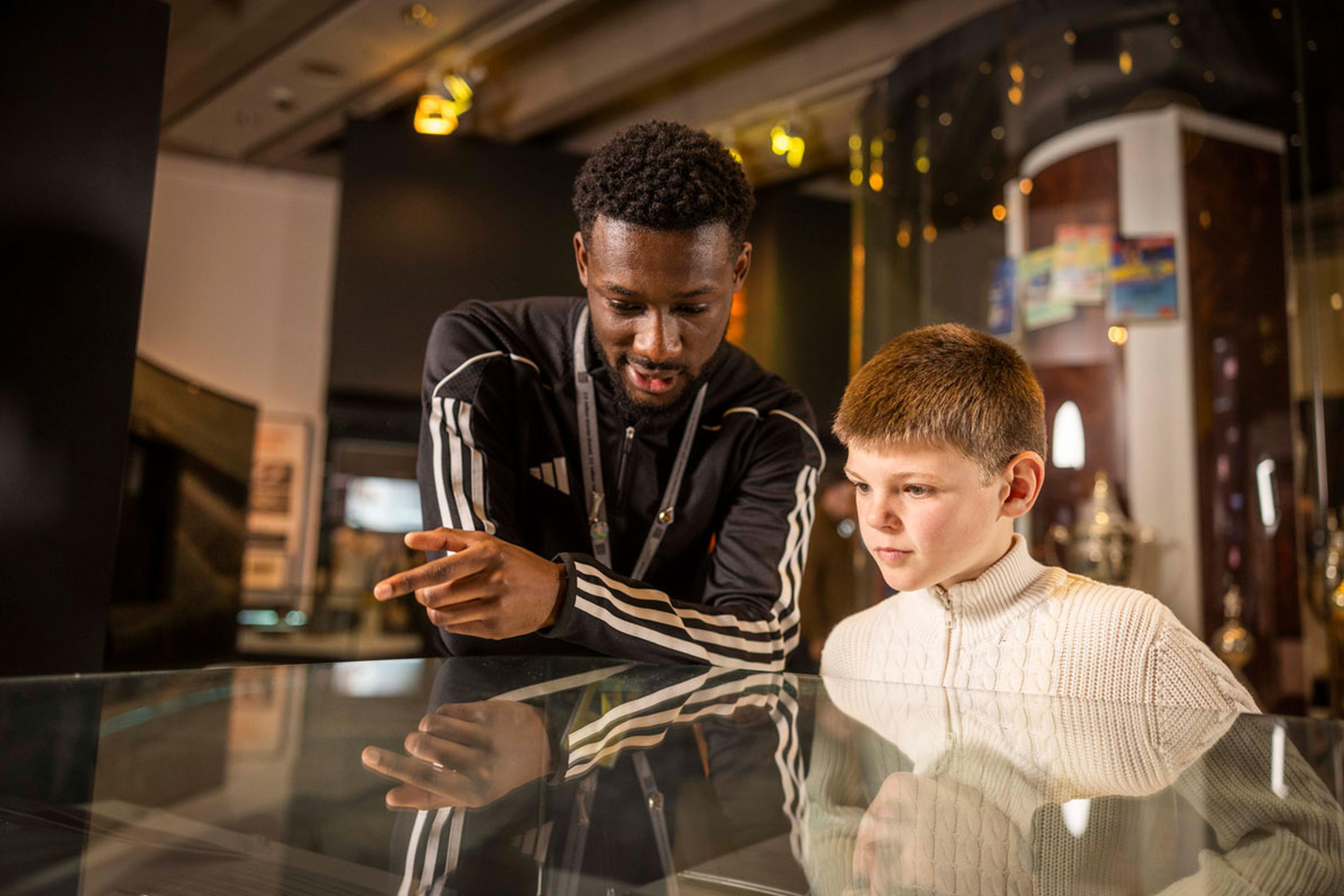 Dad and kid in a museum.