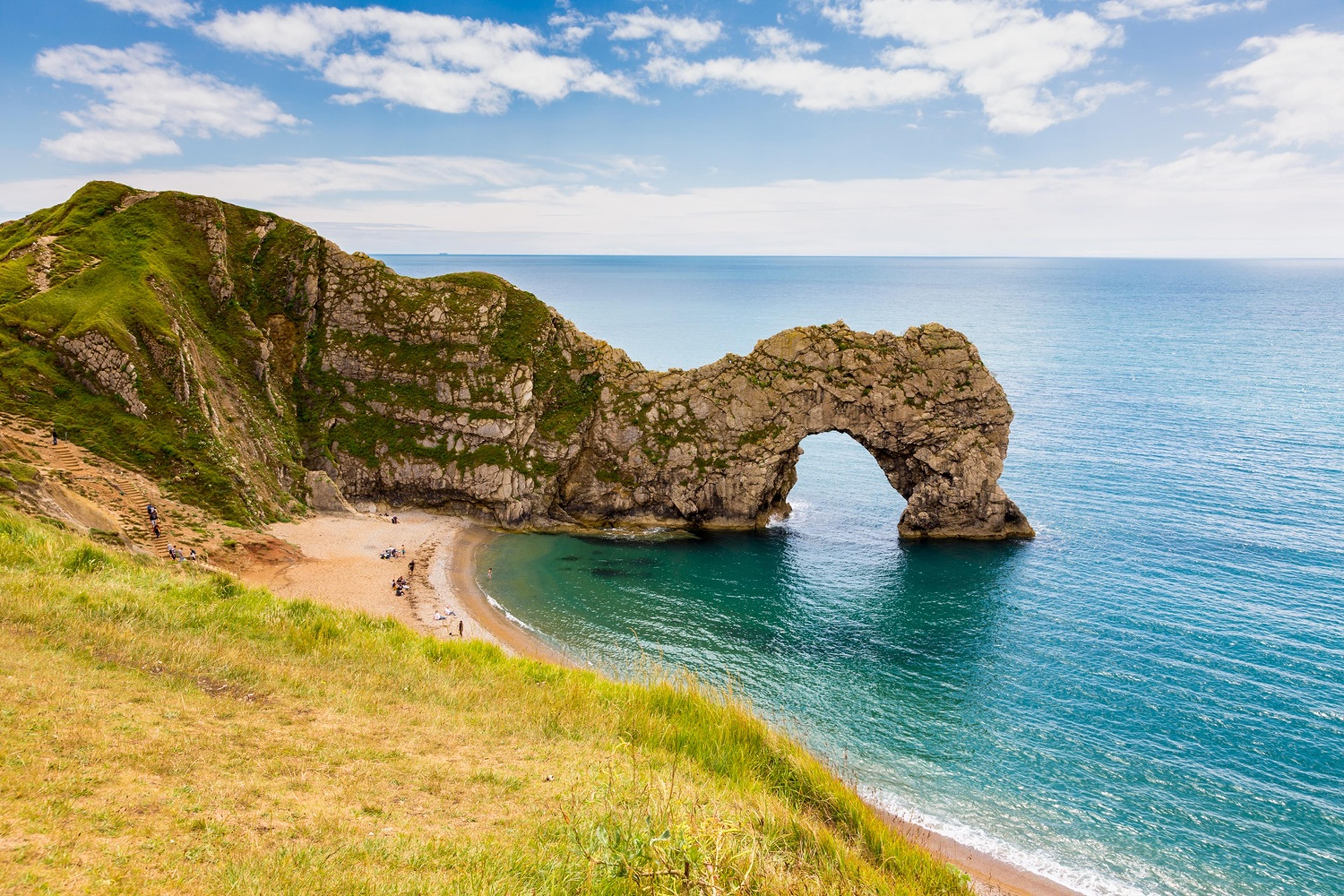 Scenic coastal view of Durdle Door, a natural limestone arch in Dorset