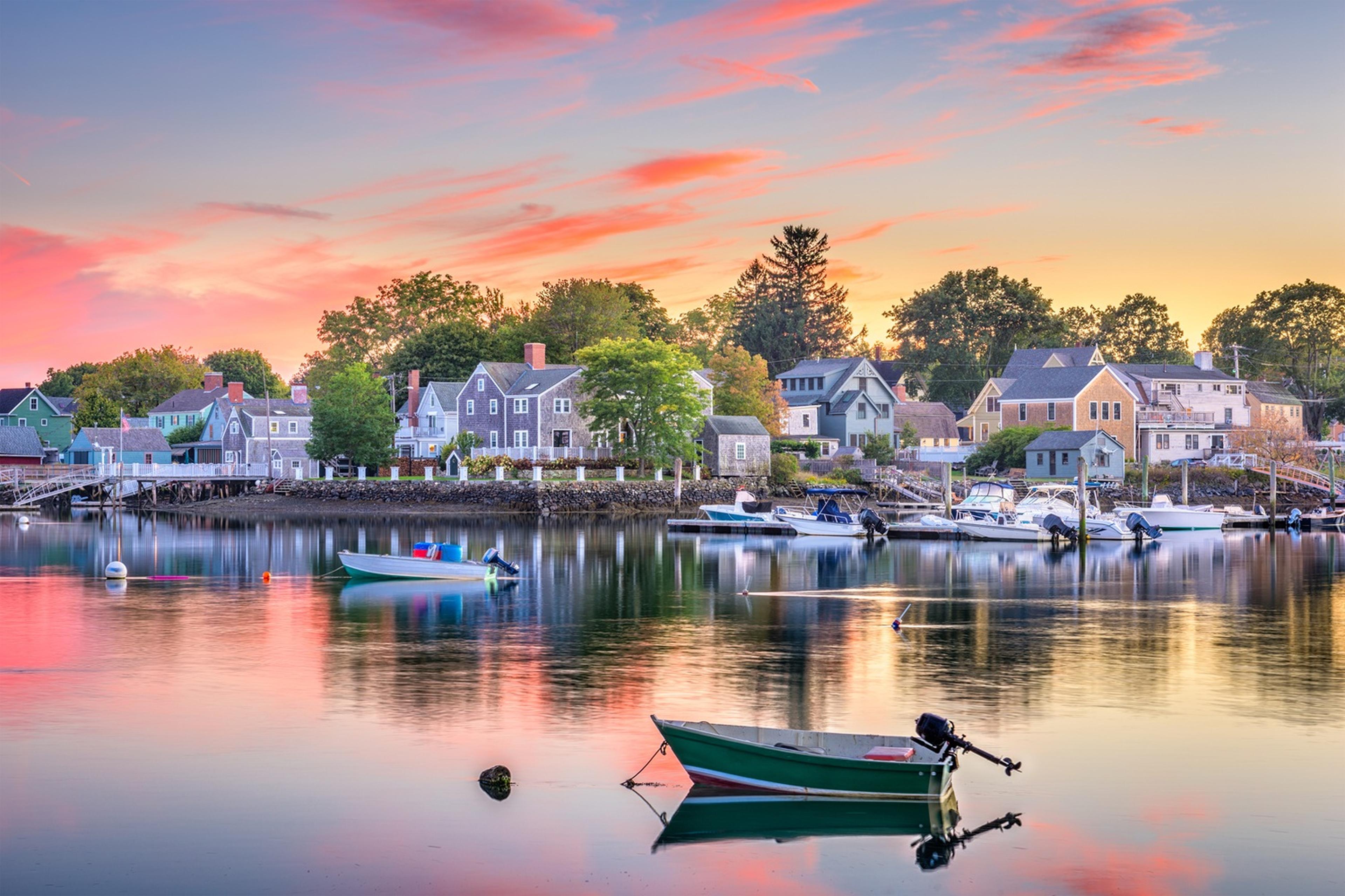 Tranquil waterfront scene at sunset with boats