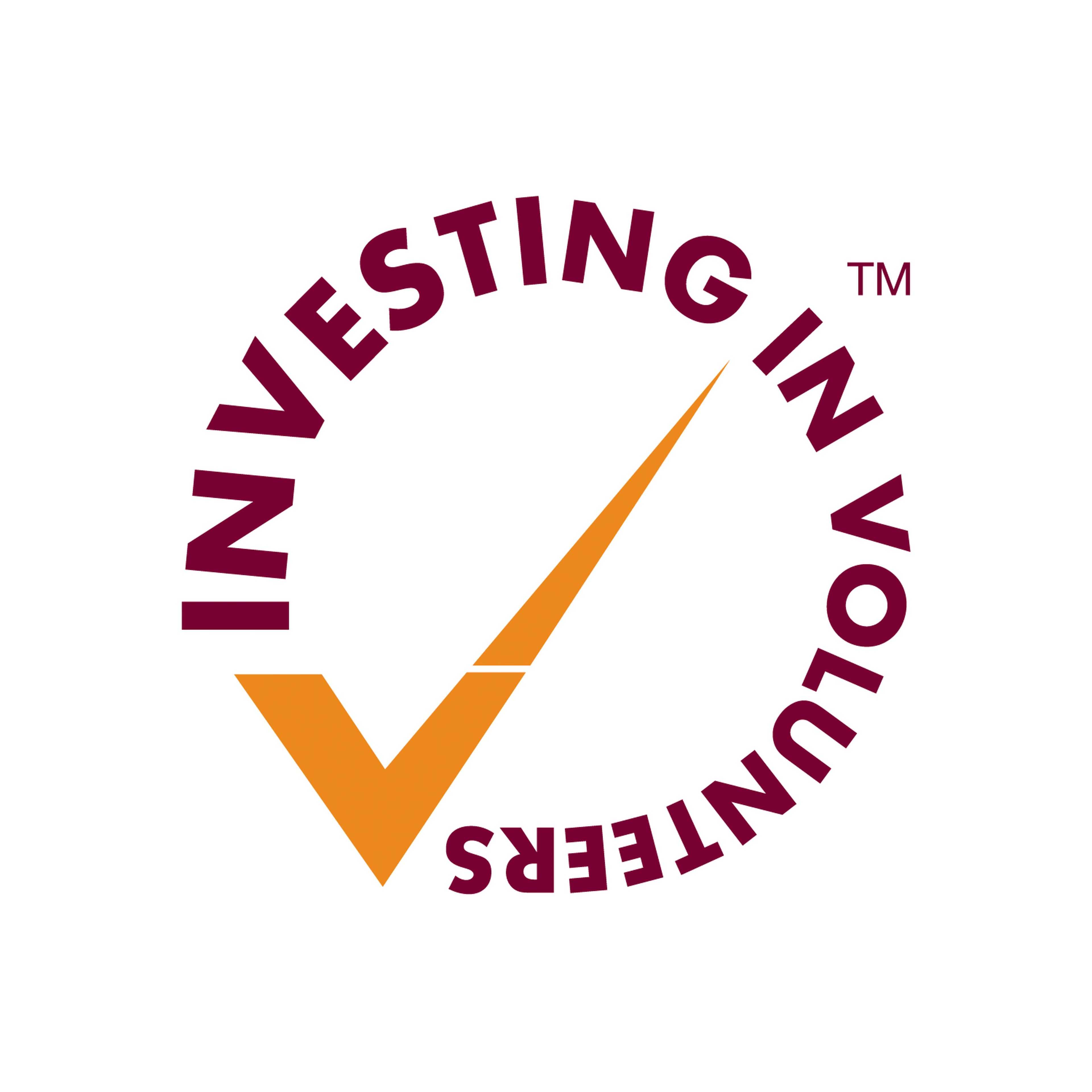 Round Investing in Volunteers logo with maroon text and an orange tick