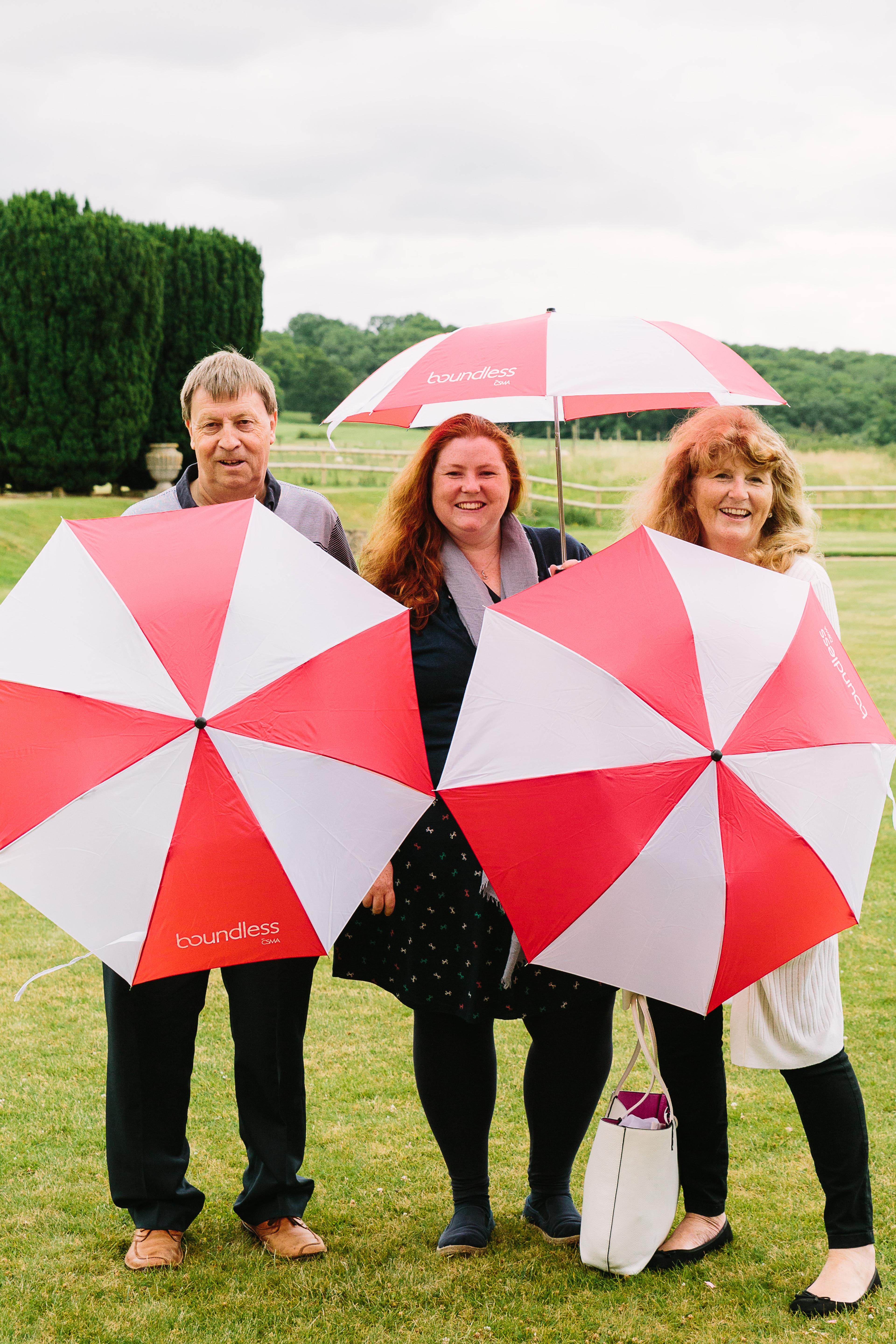 Berkshire Group Members posing with Umbrellas