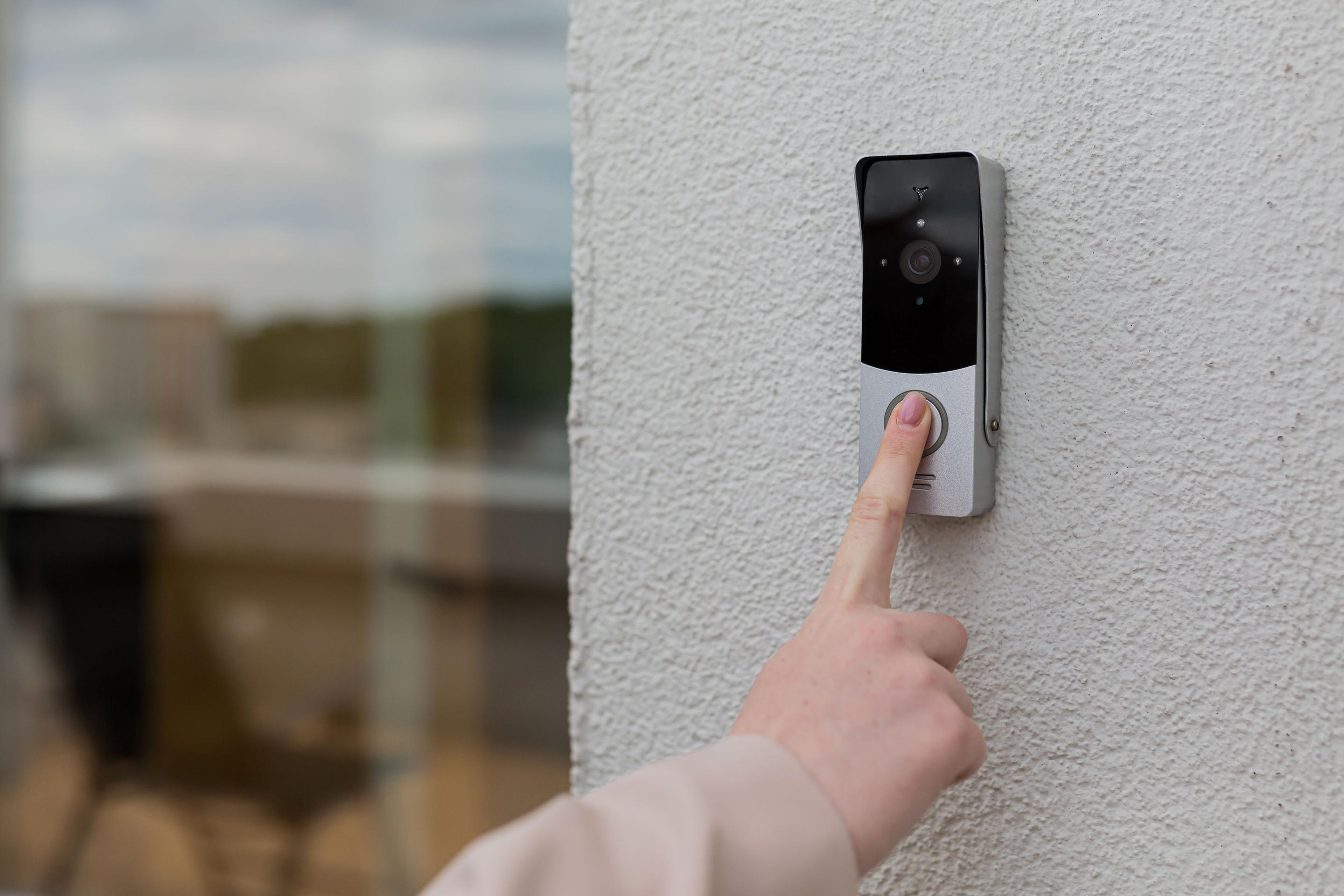 an image of someone ringing a ring door bell