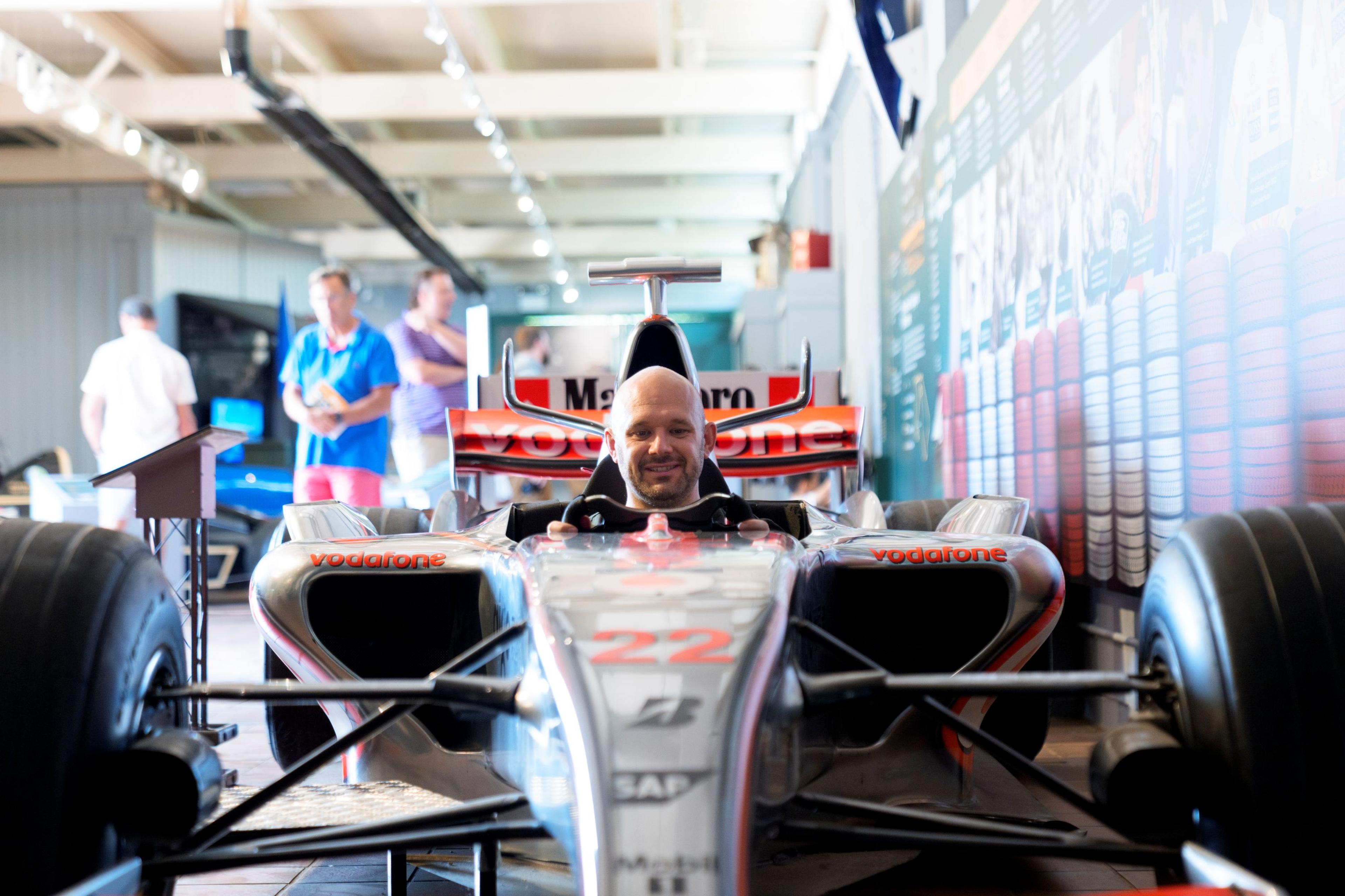 A man in a classic F1 car