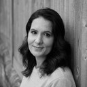 Black and white headshot of Dr Radha