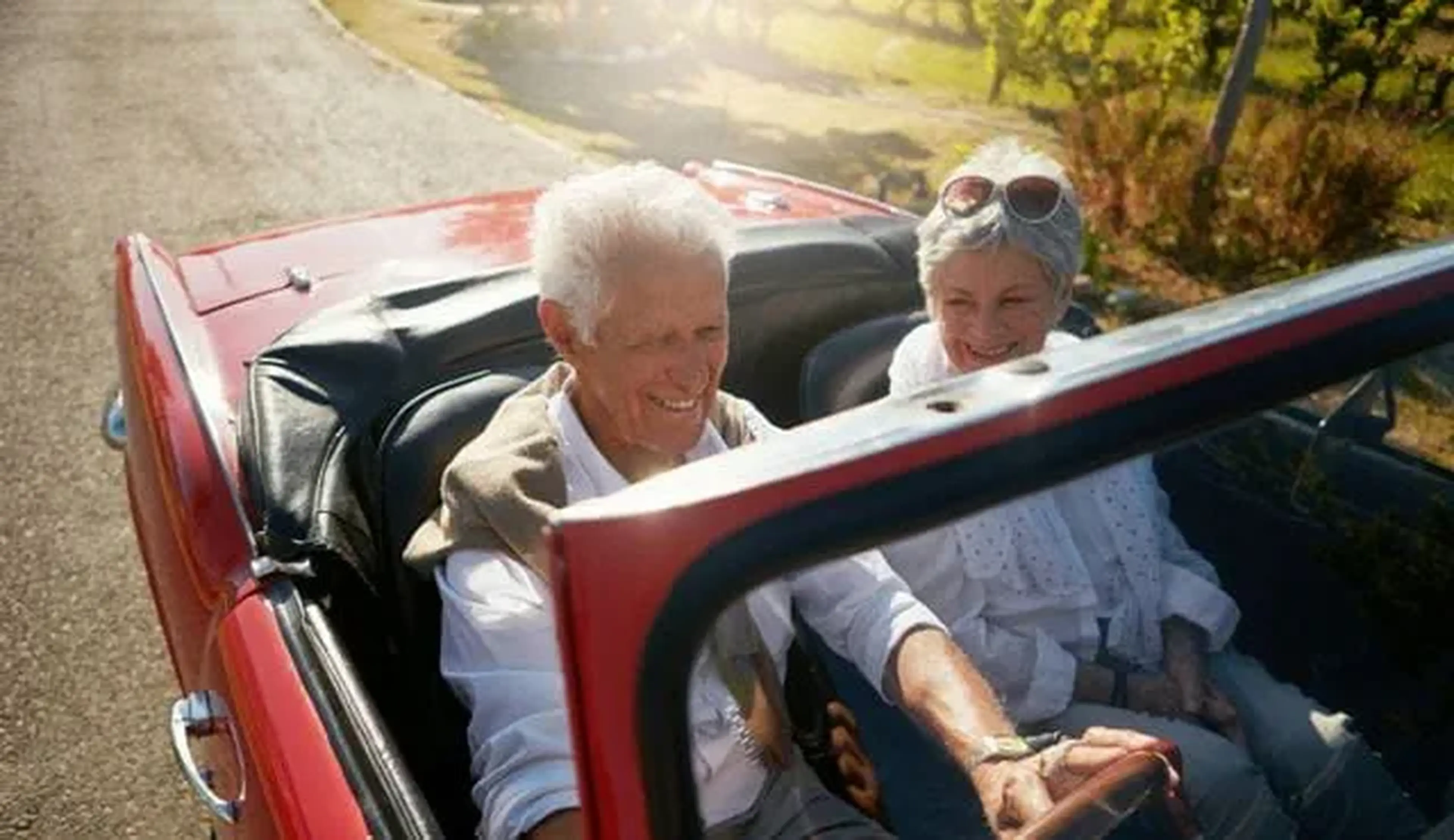 an image of two people driving a car