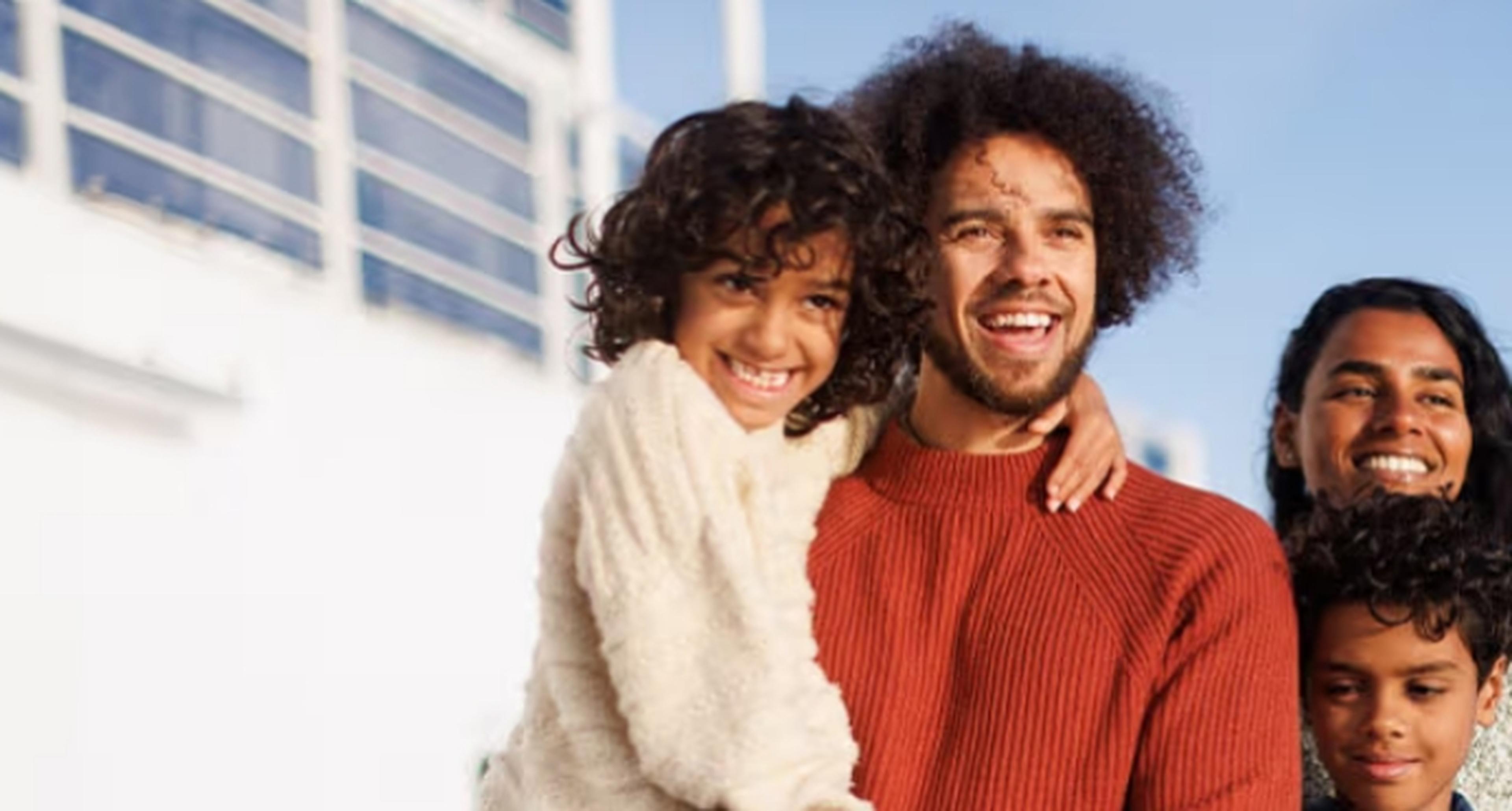 Young family standing on a ferry