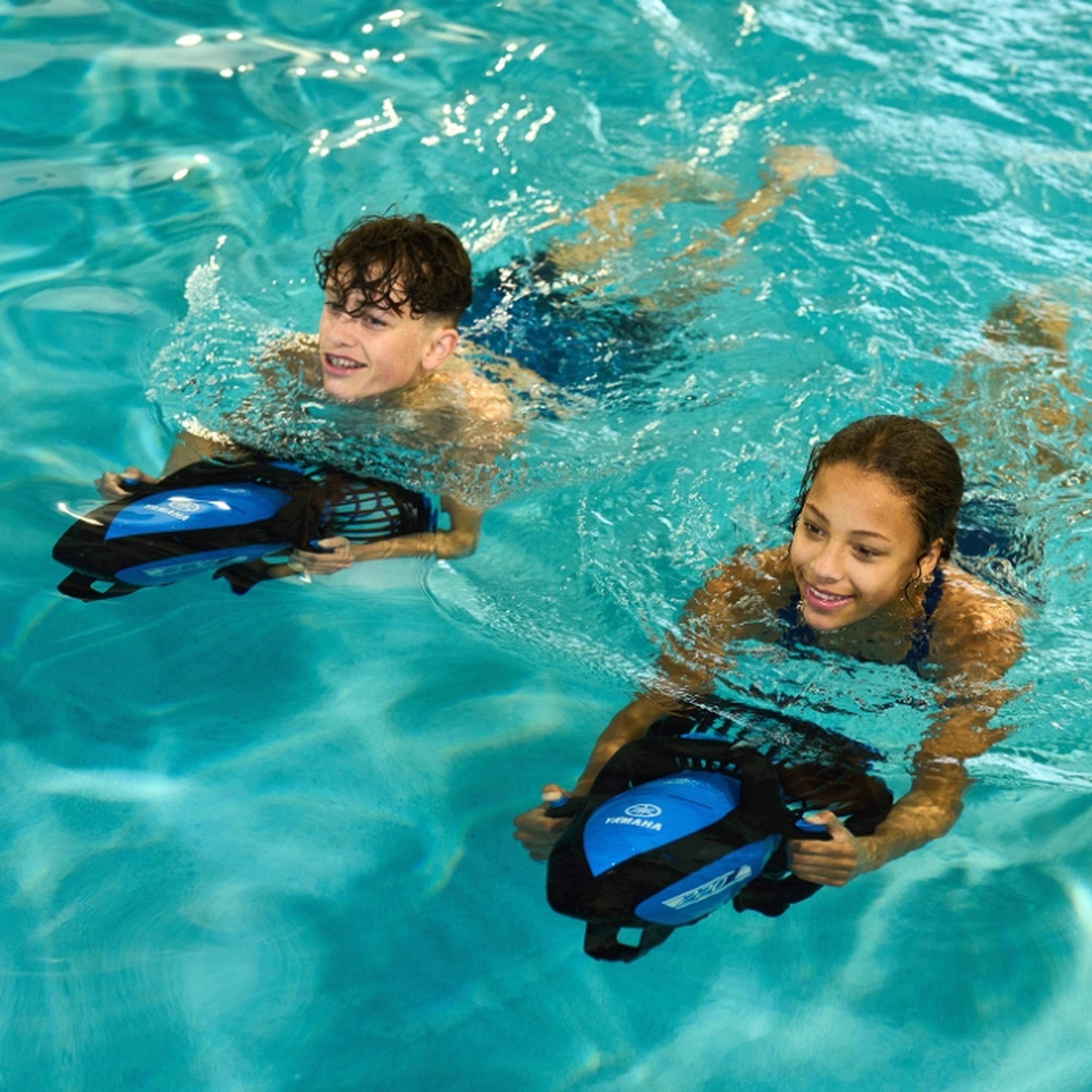 Couple of children with sea scooters in Whitemead Swimming Pool