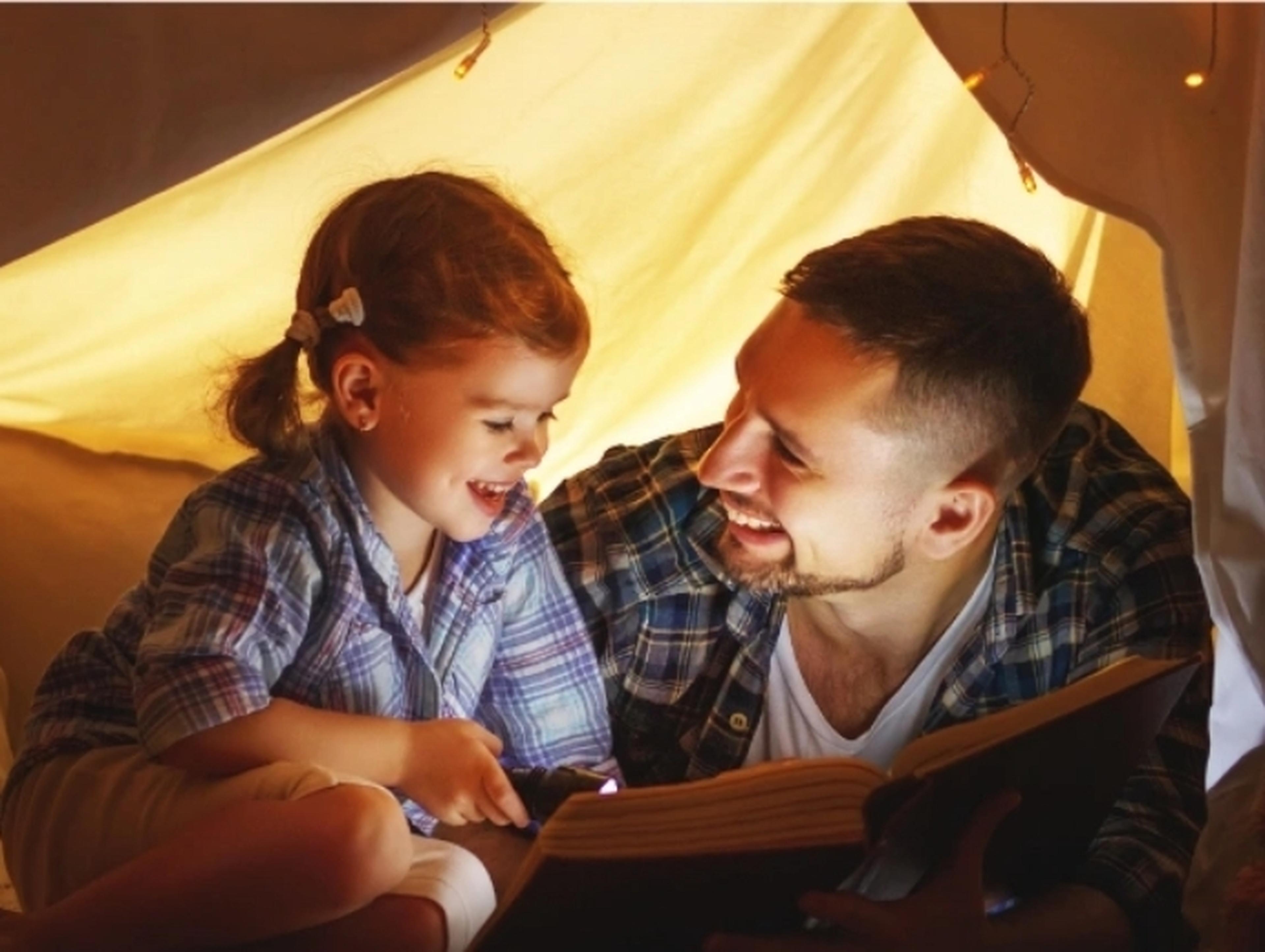 Father and daughter in a tent