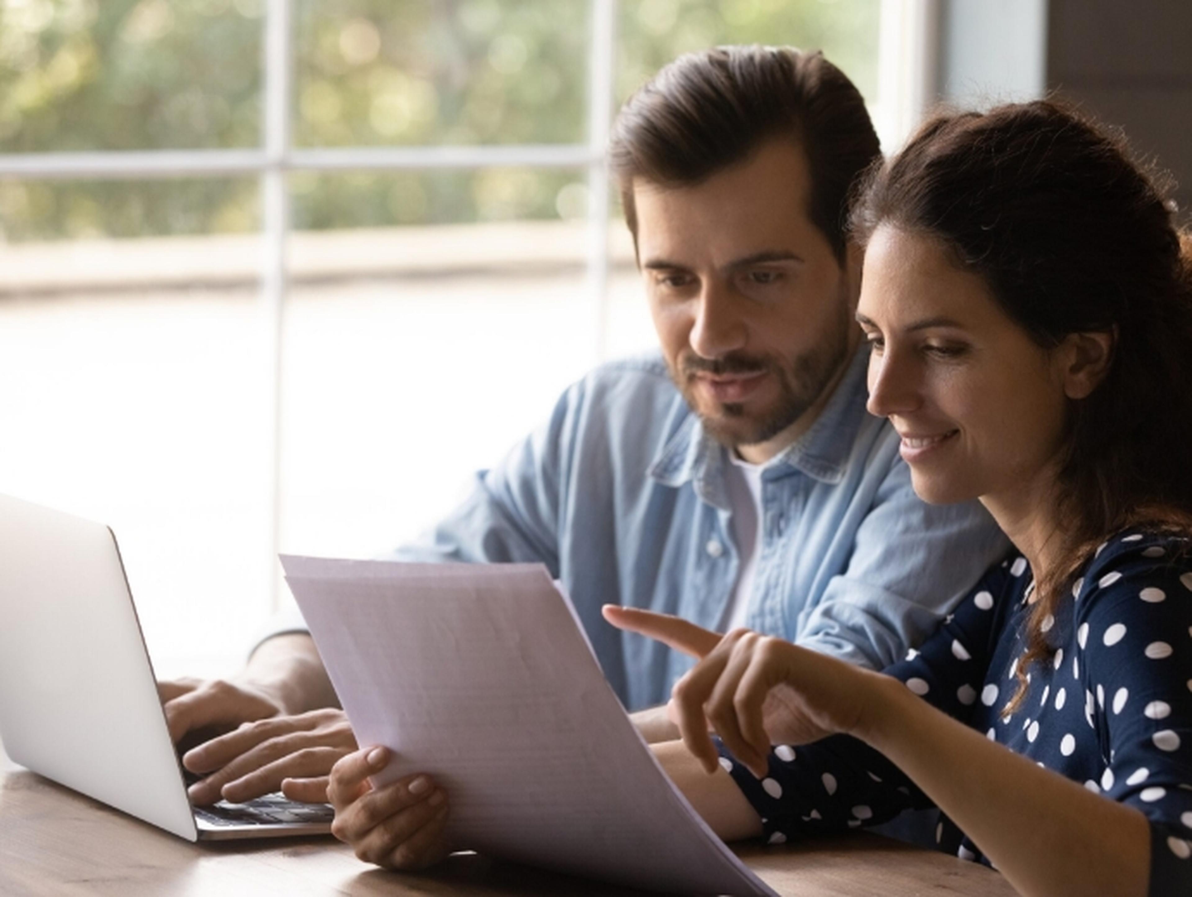 Couple looking at their laptops