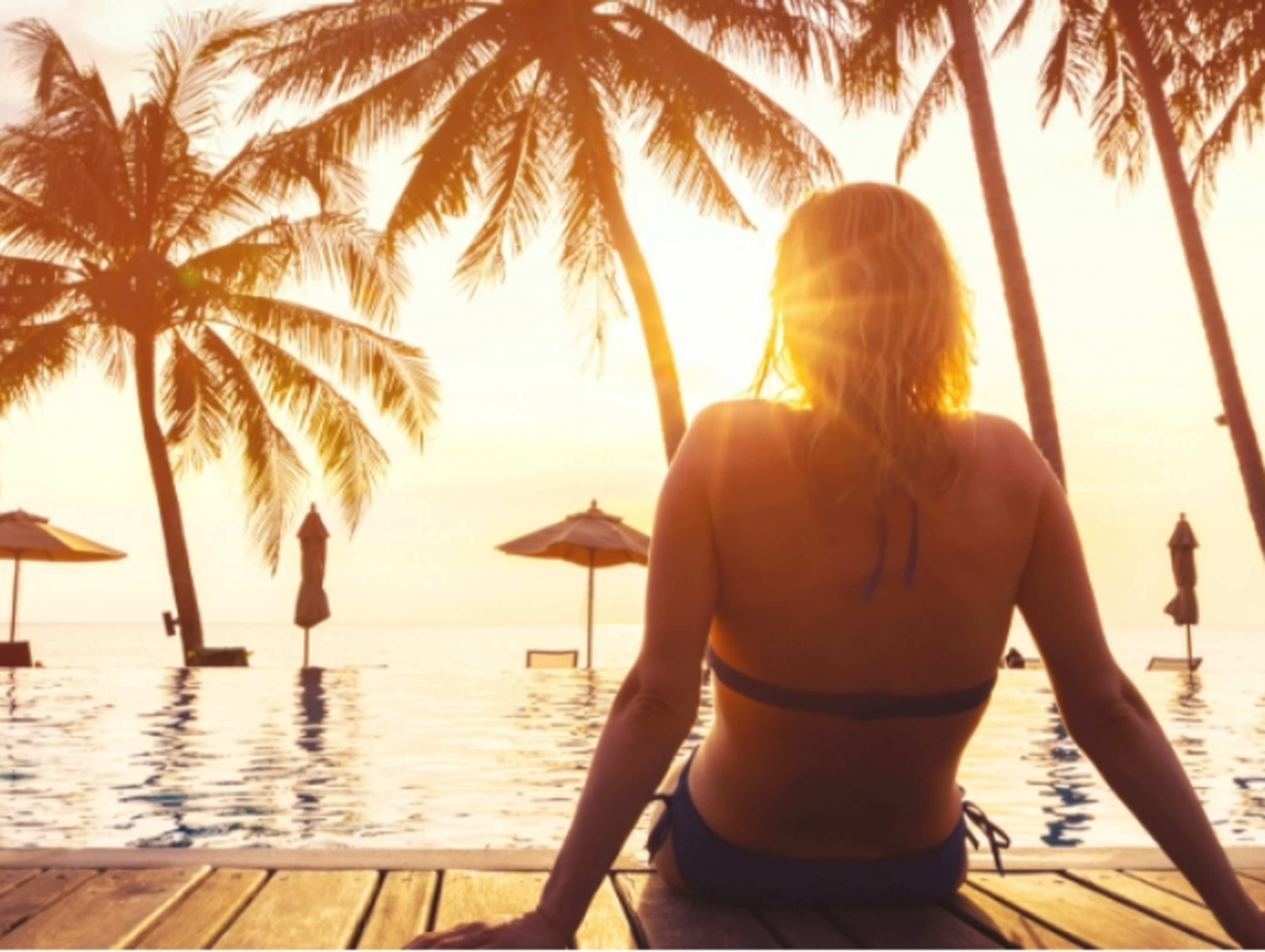 Woman relaxing by a pool