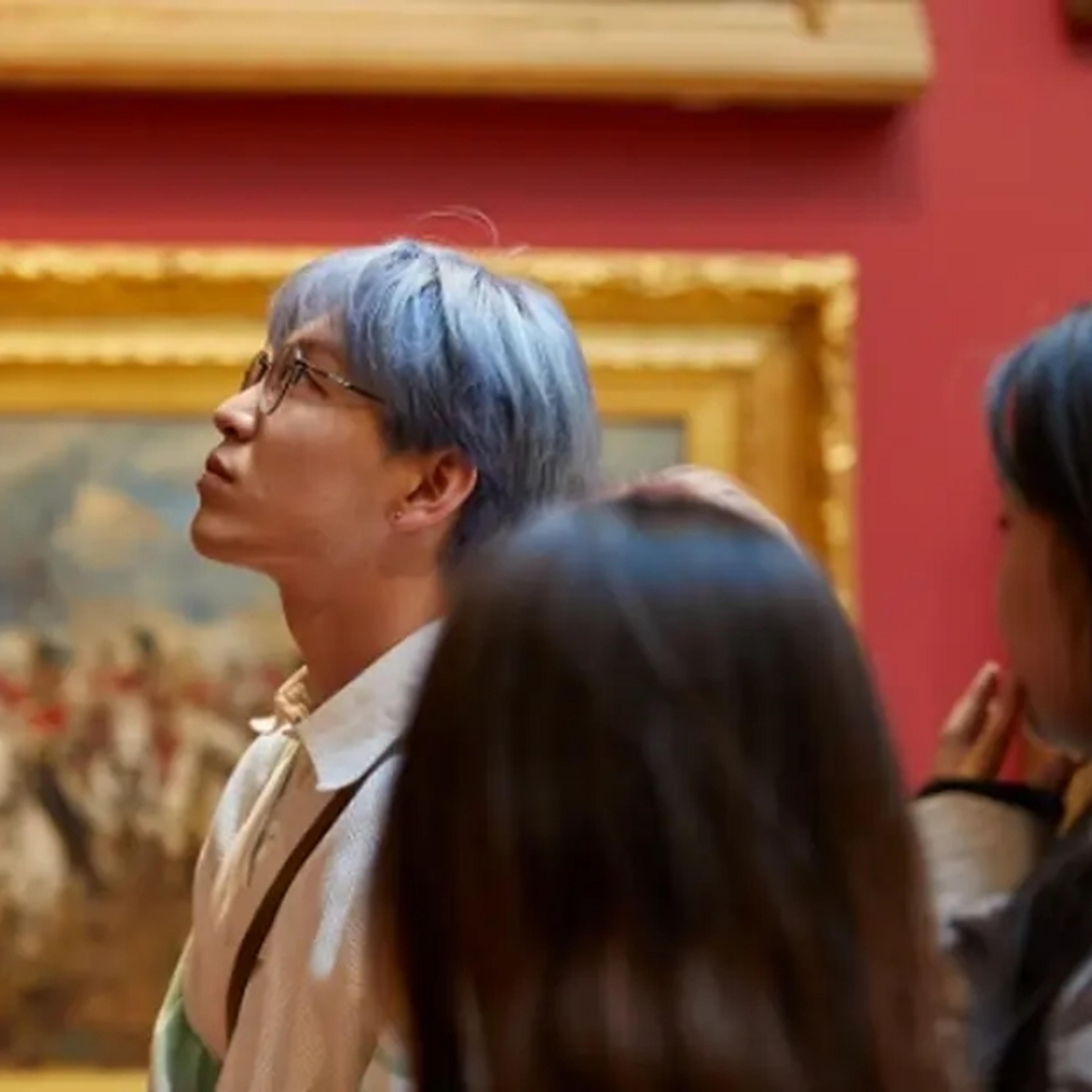 family looking at paintings