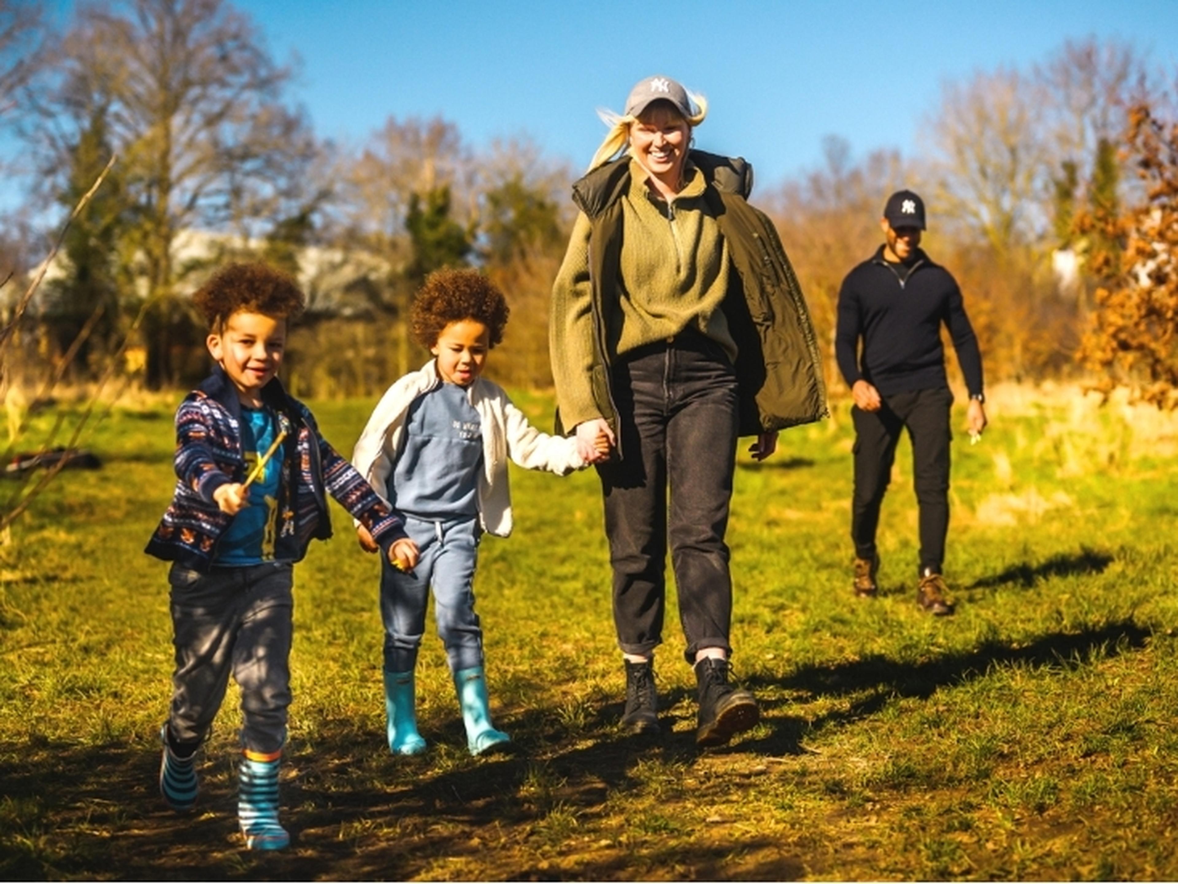 Family walking in a field