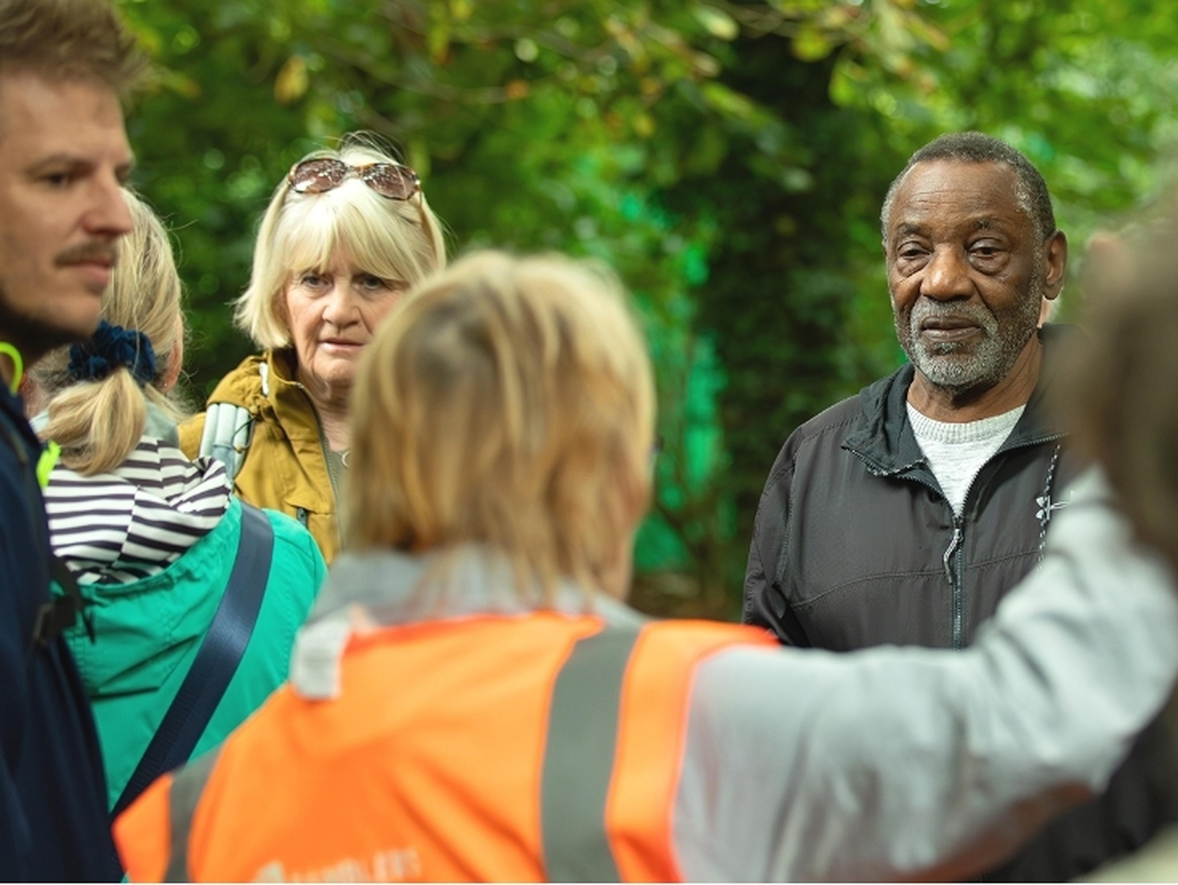 Ramblers guide talking to walkers