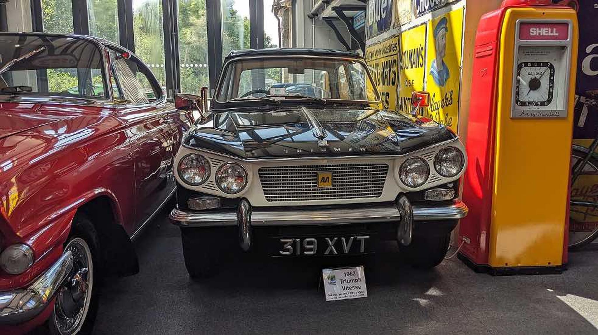 A classic black 1963 Triumph Vitesse displayed inside Lakeland Motor Museum