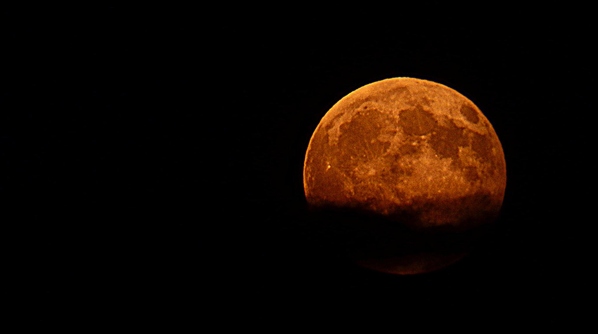 A partial lunar eclipse showing a blood-like red moon