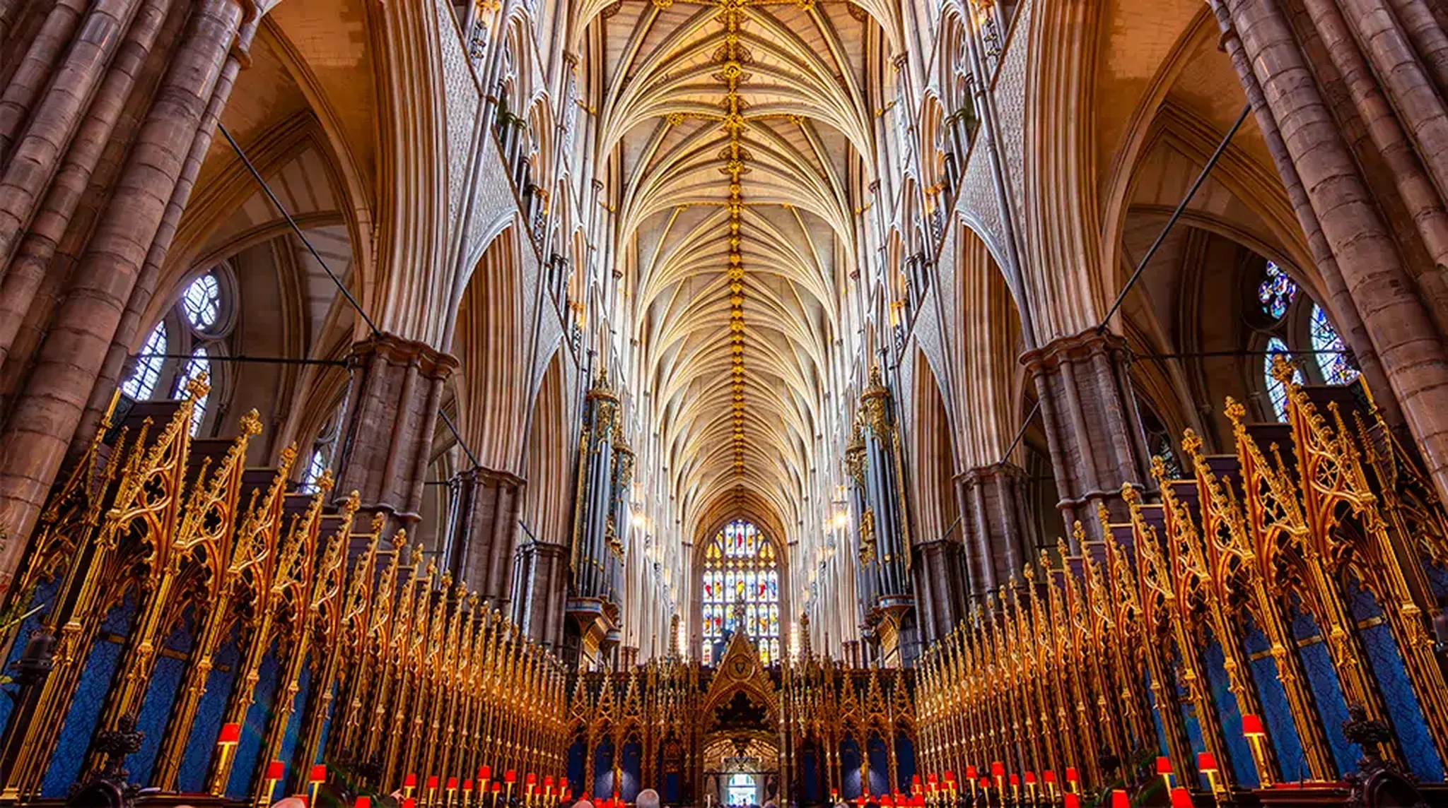 Interior view of a grand cathedral with intricate Gothic architecture